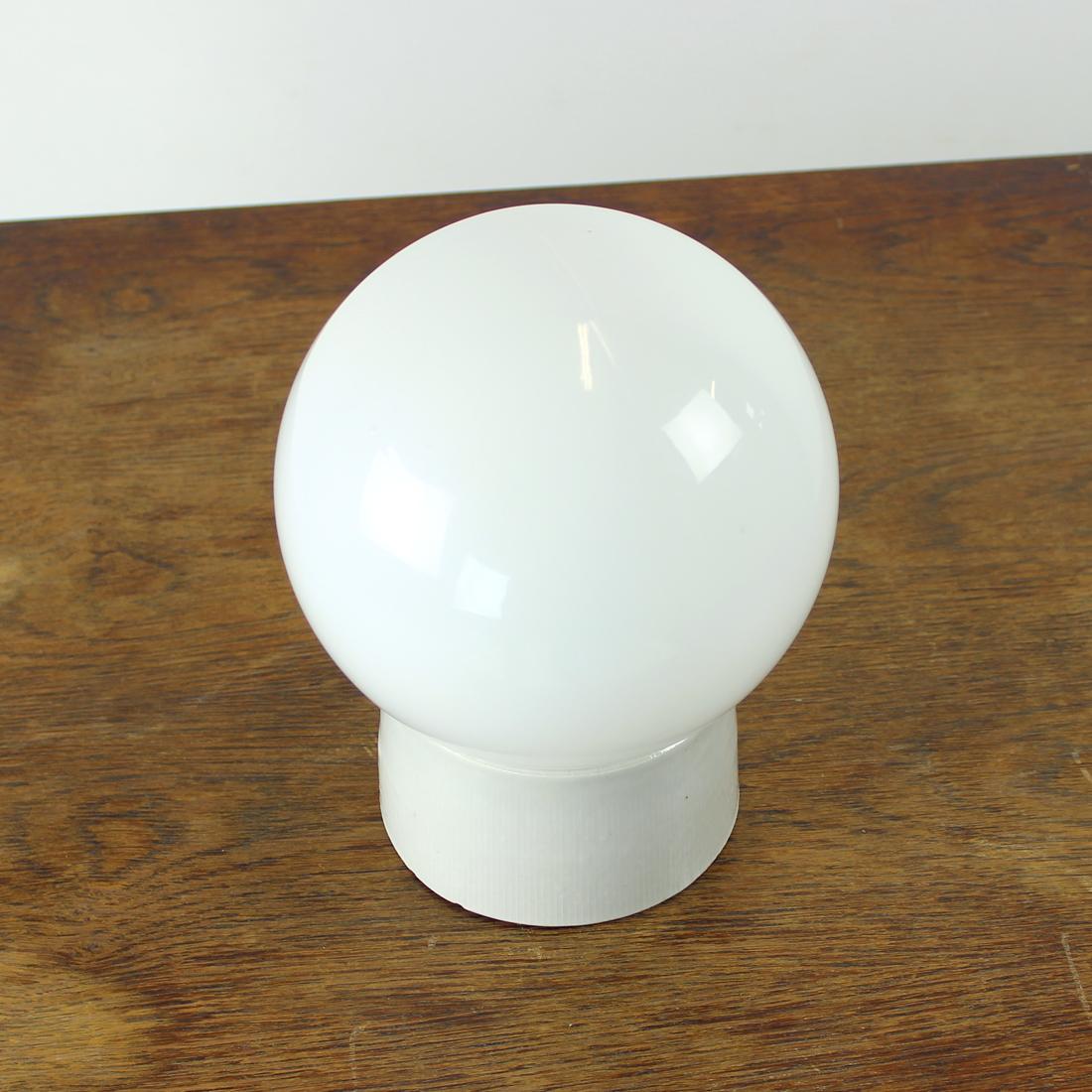 Beautiful, never used light in white & white combination. Produced in Czechoslovakia in 1960s, the lights were never used. We have 4 of them available. The base is in a white/ slightly grayish ceramic, the shield is in white opaline in a shape of