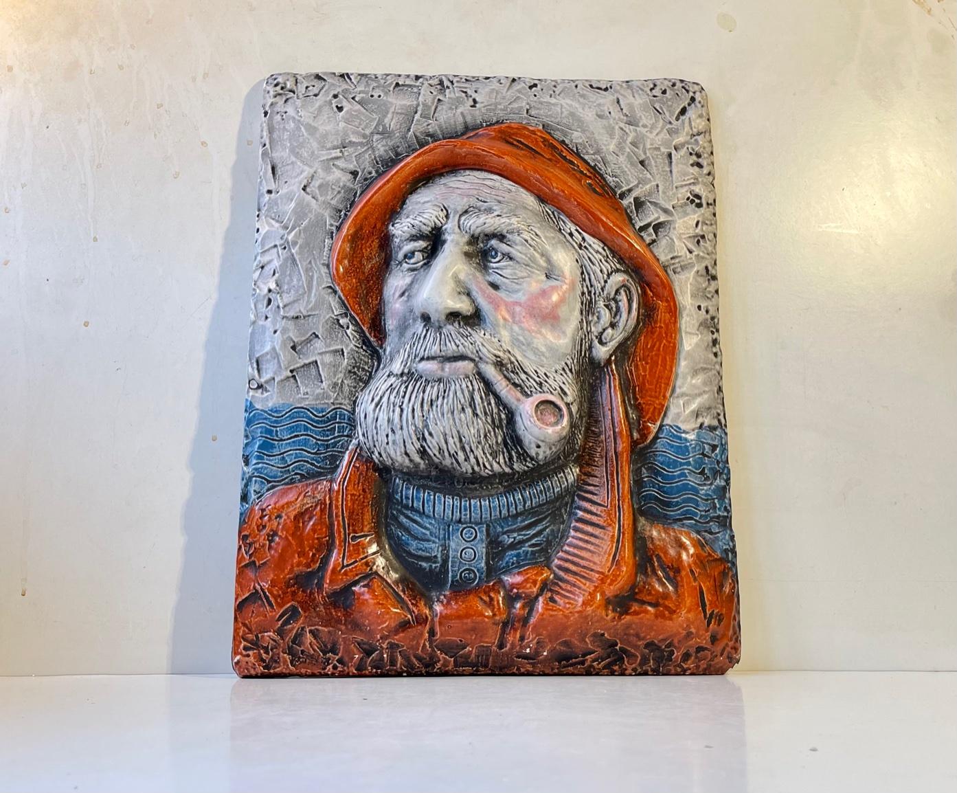 This heavy hand-colored wall relief in cast plaster uzzes masculinity . It depicts a dutch seaman/captain called Dorus Rijkers who rescued over 500 people lost at sea between 1870-1890. He was originally portrayed in an oil painting by the Dutch