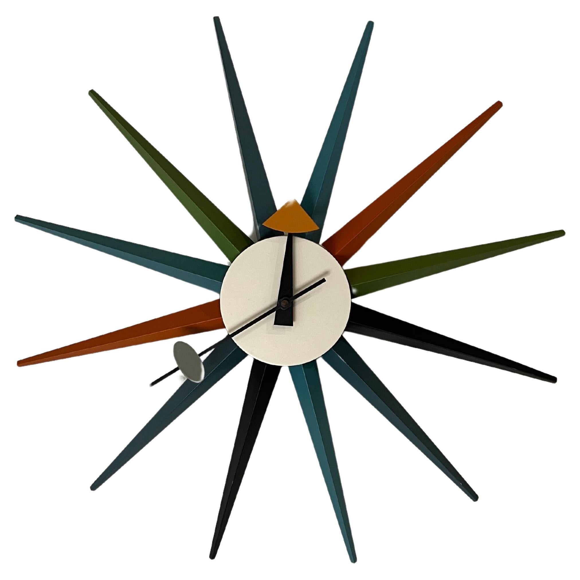 Klassik Mid-Century Modern, Atomic age vintage wall clock designed by George Nelson for Vitra, better-operated mechanism, made in Germany circa 1990s in working condition.