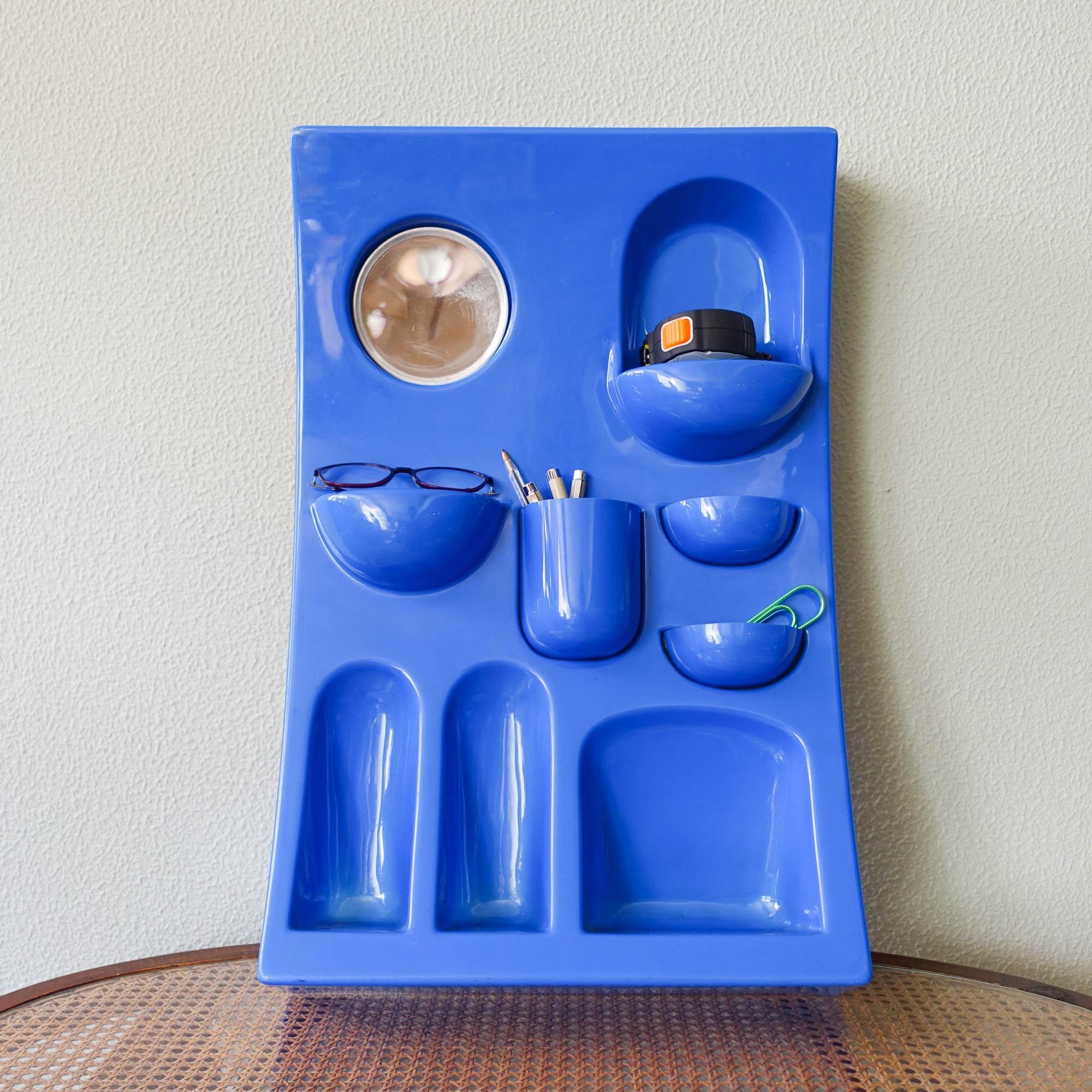 A blue ABS plastic wall organizer from the 1970s. Designed and produced by Visiva srl, Milano, Italy, during the 1970's. Similar with the Uten.Silo by Dorothee Becker for Vitra. With a variety of little pockets, containers, shelves and a mirror.