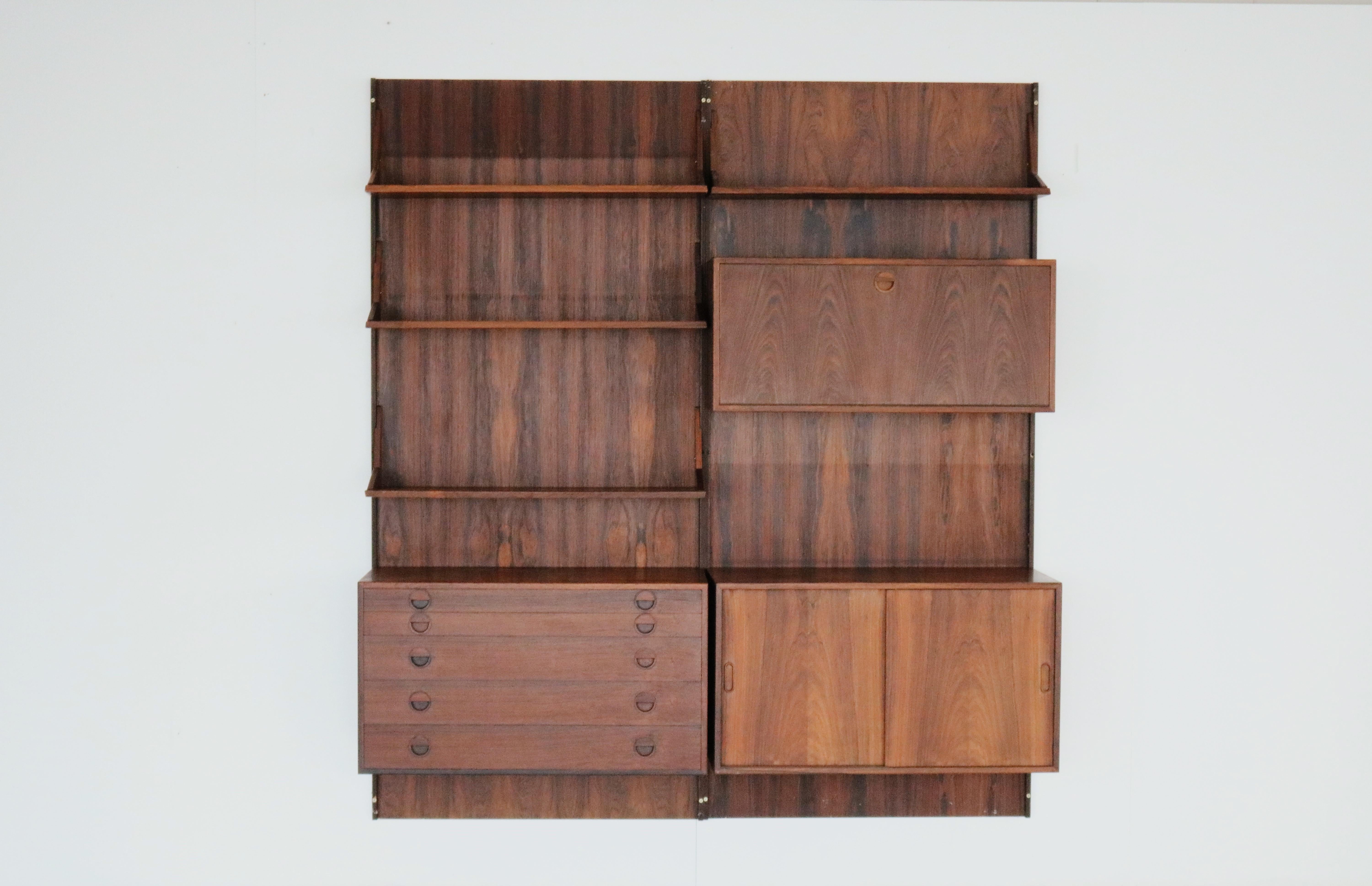 Vintage wall system rosewood HG Furniture Danish.

Rosewood wall system designed by Rud Thygesen & Johnny Sorensen for HG Furniture. The system is of high quality and can be arranged according to your own wishes.

Period 1960s
Designs Rud