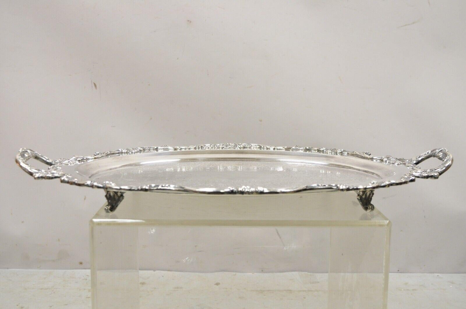 Vintage Wallace Royal Rose 9826 silver plated ornate oval serving platter tray. Item features a nice oval form, ornate twin handles, scalloped form, original stamp, very nice vintage item, great style and form, circa early 1900s. Measurements: 27.5