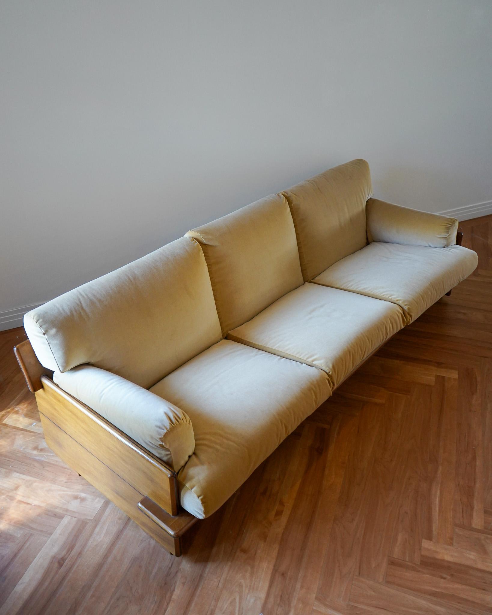 Uncommon 3 seat sofa featuring an architectural wood frame with thick, interlocking slabs of Italian walnut softened with warm, sandy velvet cushions. Beautiful from every angle.

Cushions are newly upholstered. Frame in good vintage condition with