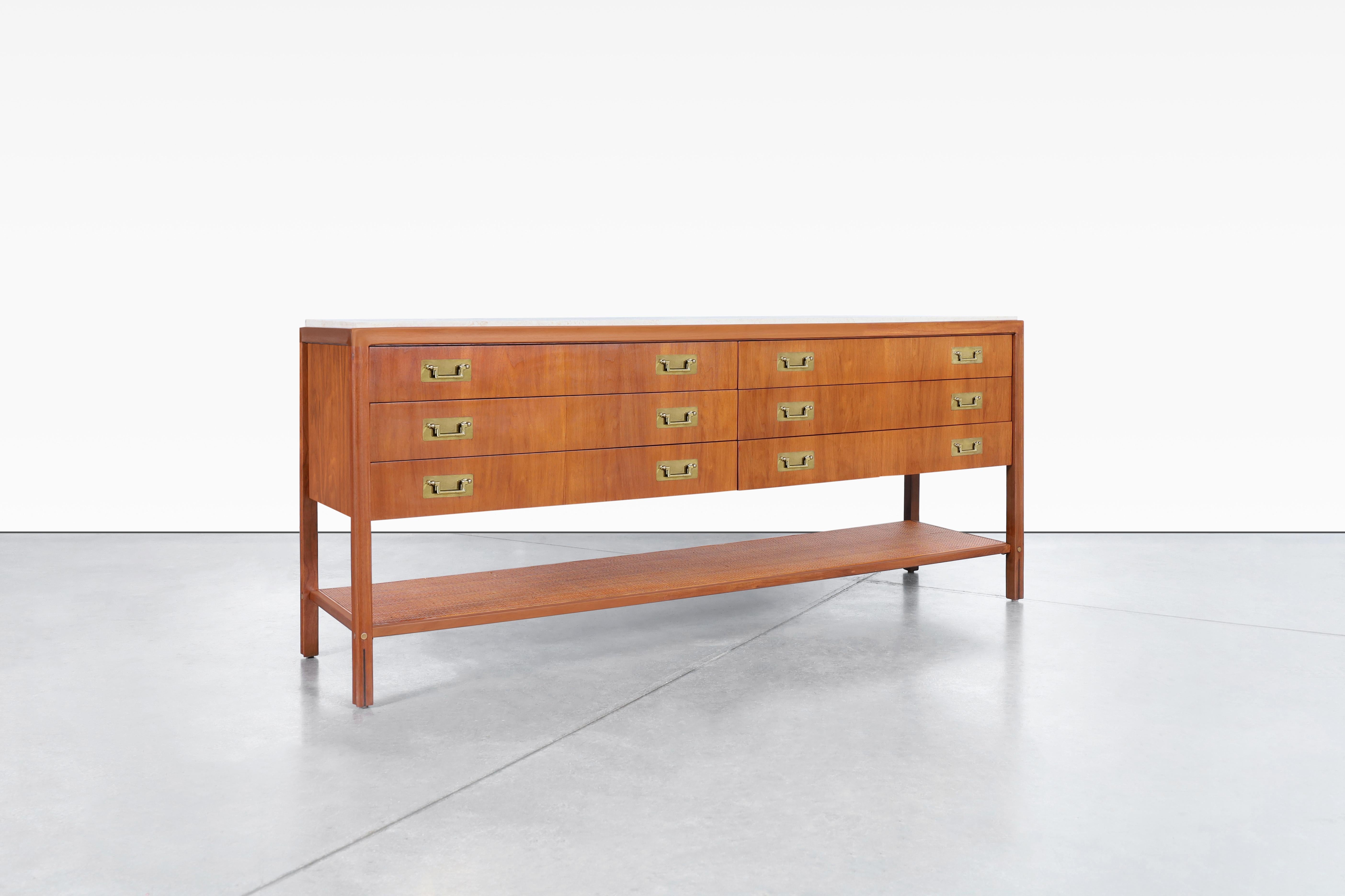 Wonderful vintage walnut and travertine sideboard designed by Gerry Zanck for Gregori Furniture in the United States, circa 1960s. This walnut sideboard is a true masterpiece, crafted to perfection with impeccable attention to detail. Its solid