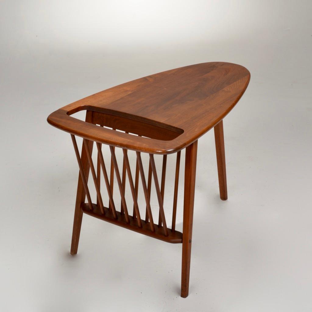 Arthur Umanoff solid walnut side table with attached magazine rack.