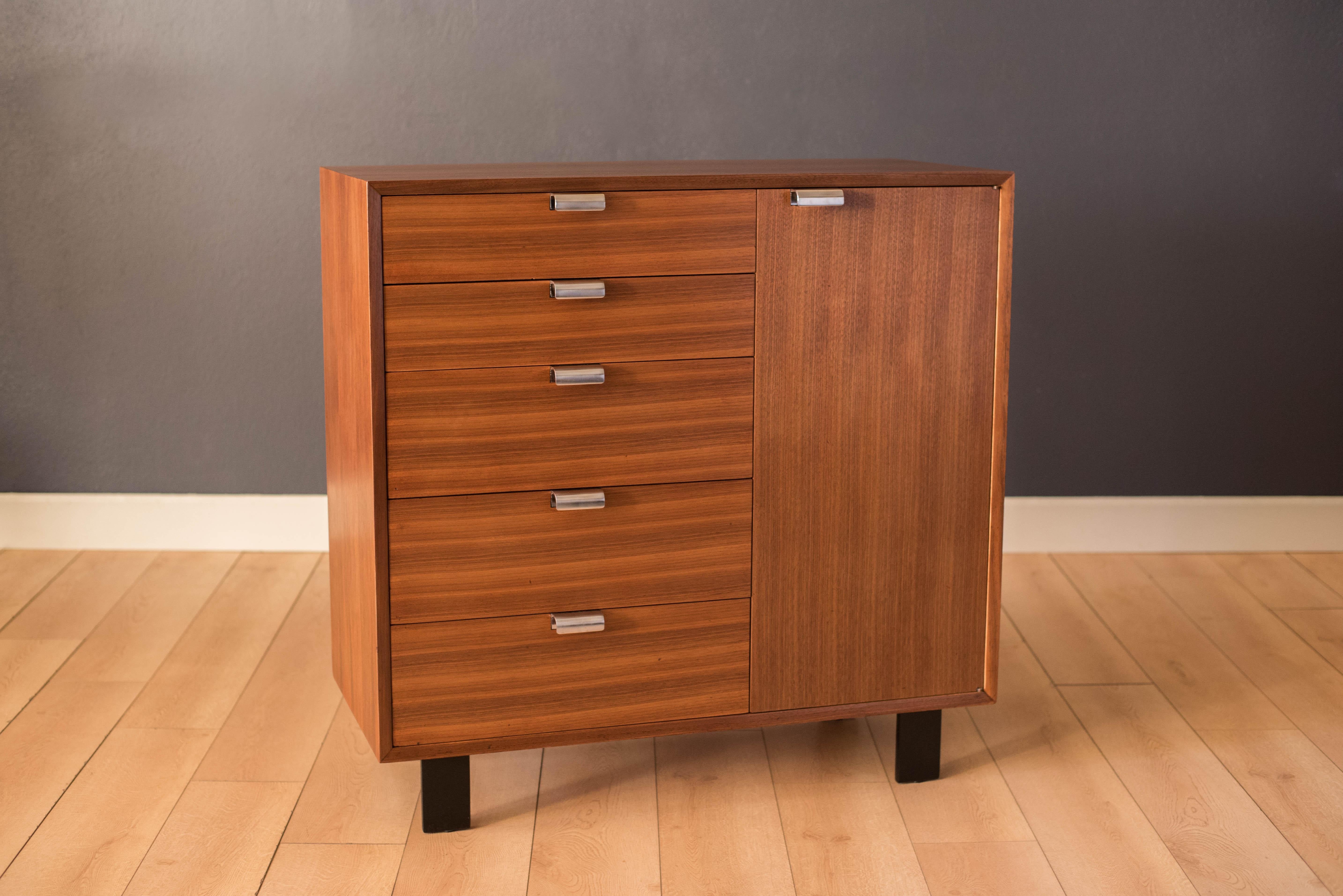 Mid-Century Modern BCS dresser chest model no. 4621 designed by George Nelson for Herman Miller in walnut circa 1950s. This piece offers plenty of storage including five dovetailed drawers and a closed cabinet with adjustable shelving. Features the