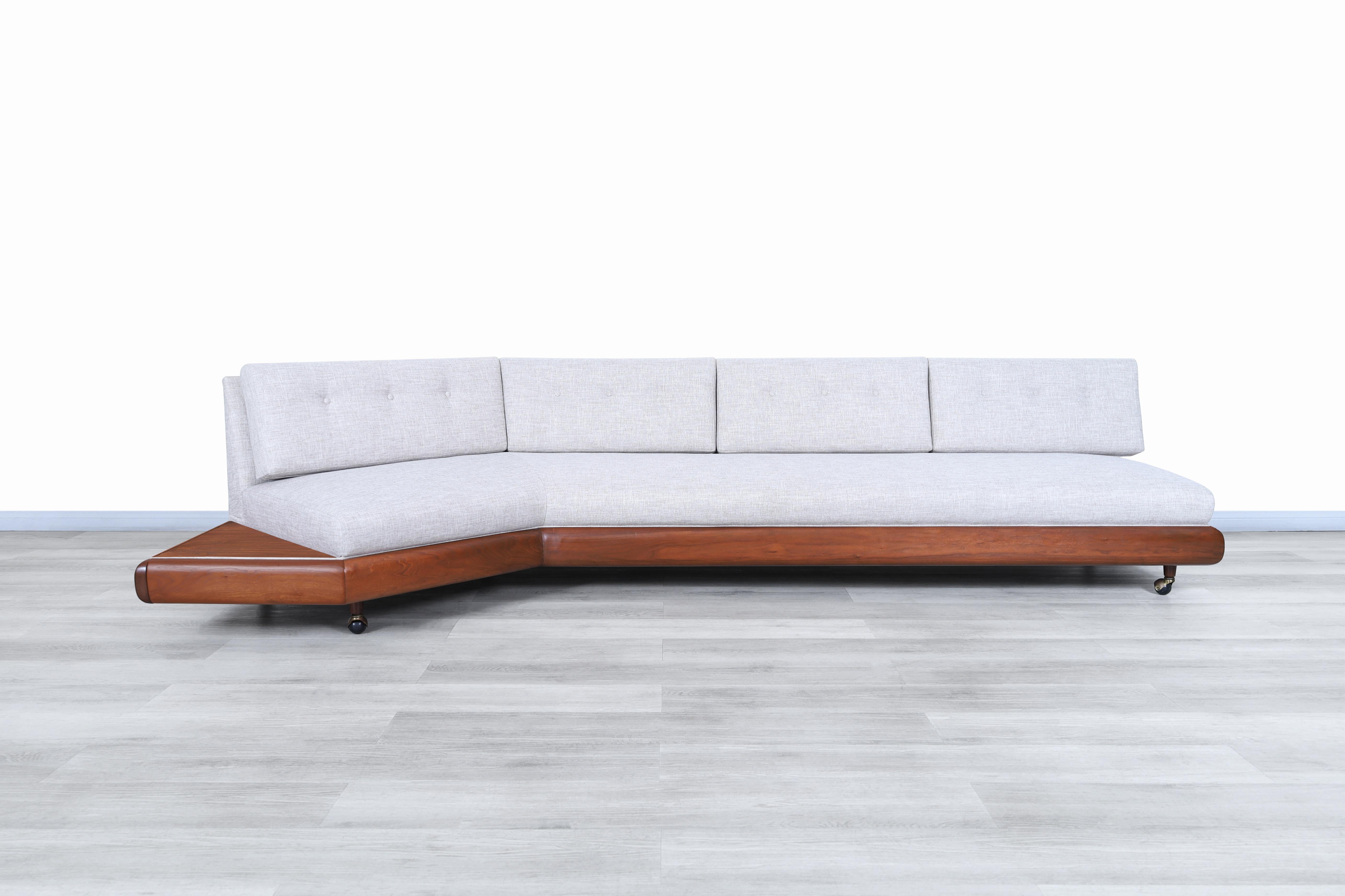 Stunning vintage walnut “Boomerang” sofa designed by Adrian Pearsall for Craft Associates in the United States, circa 1960s. This sofa has a structurally detailed design where the polygonal shape of its lines and the intricate construction details