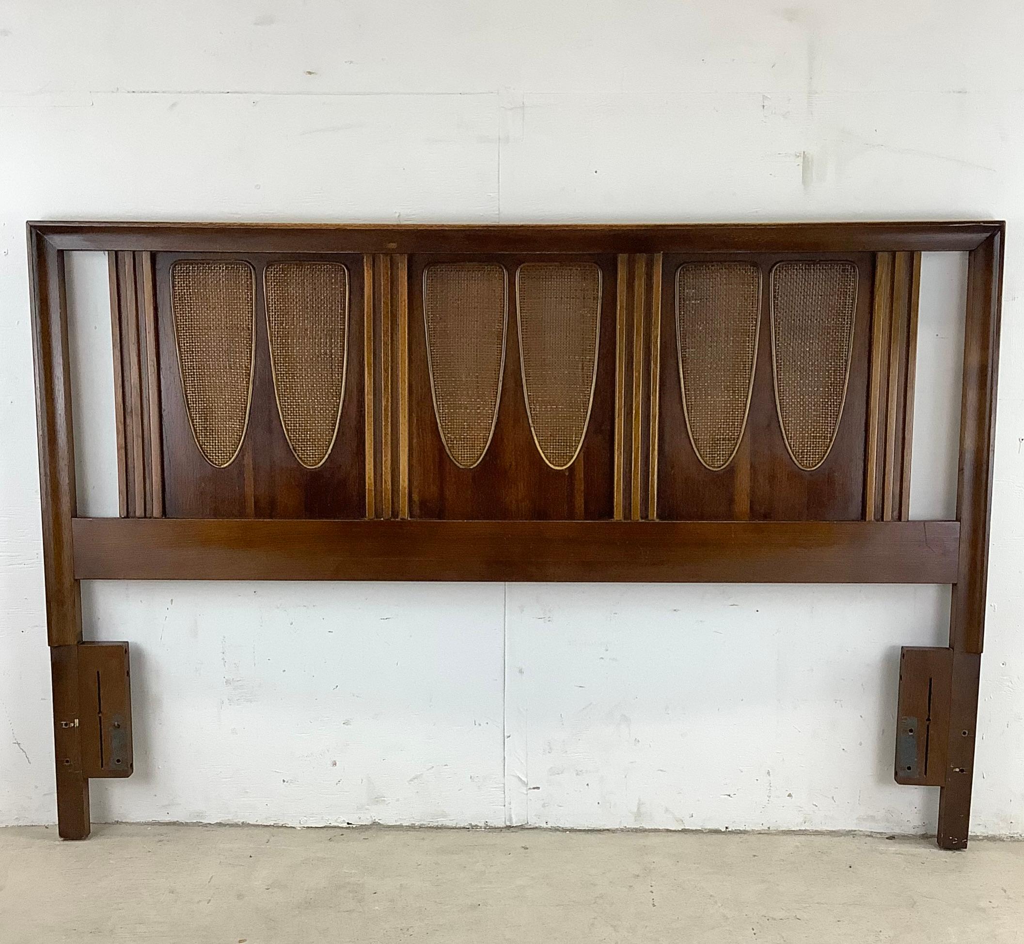 This Mid-century Walnut Headboard with Cane Detail is designed to add a touch of elegance and sophistication to your bedroom. This exquisite headboard is crafted with high-quality walnut wood and features a beautiful cane detailing that exudes a