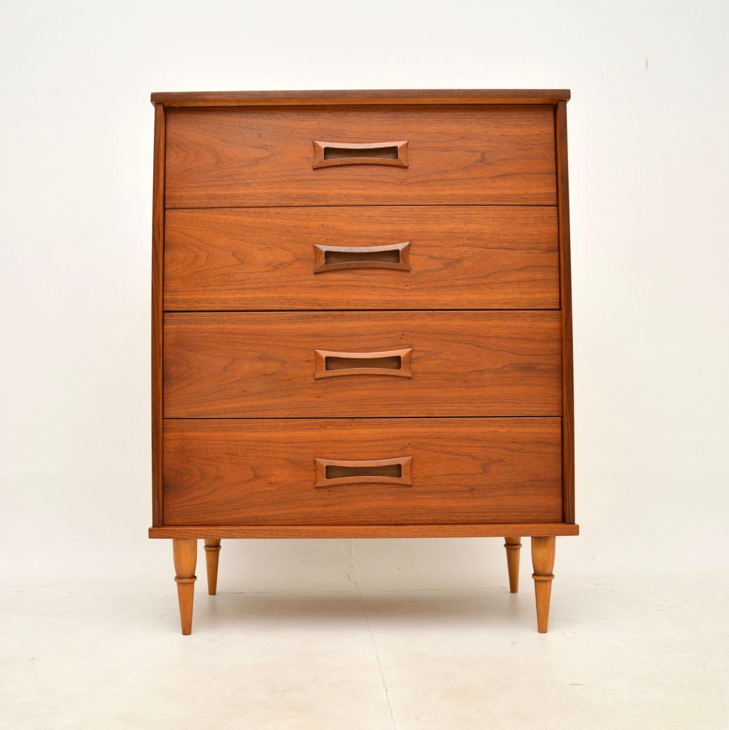 A very stylish and well made vintage walnut chest of drawers. This was made in the USA, it dates from the 1960’s.

The quality is excellent, this is beautifully designed and has lots of storage space inside the four generous drawers. The drawer