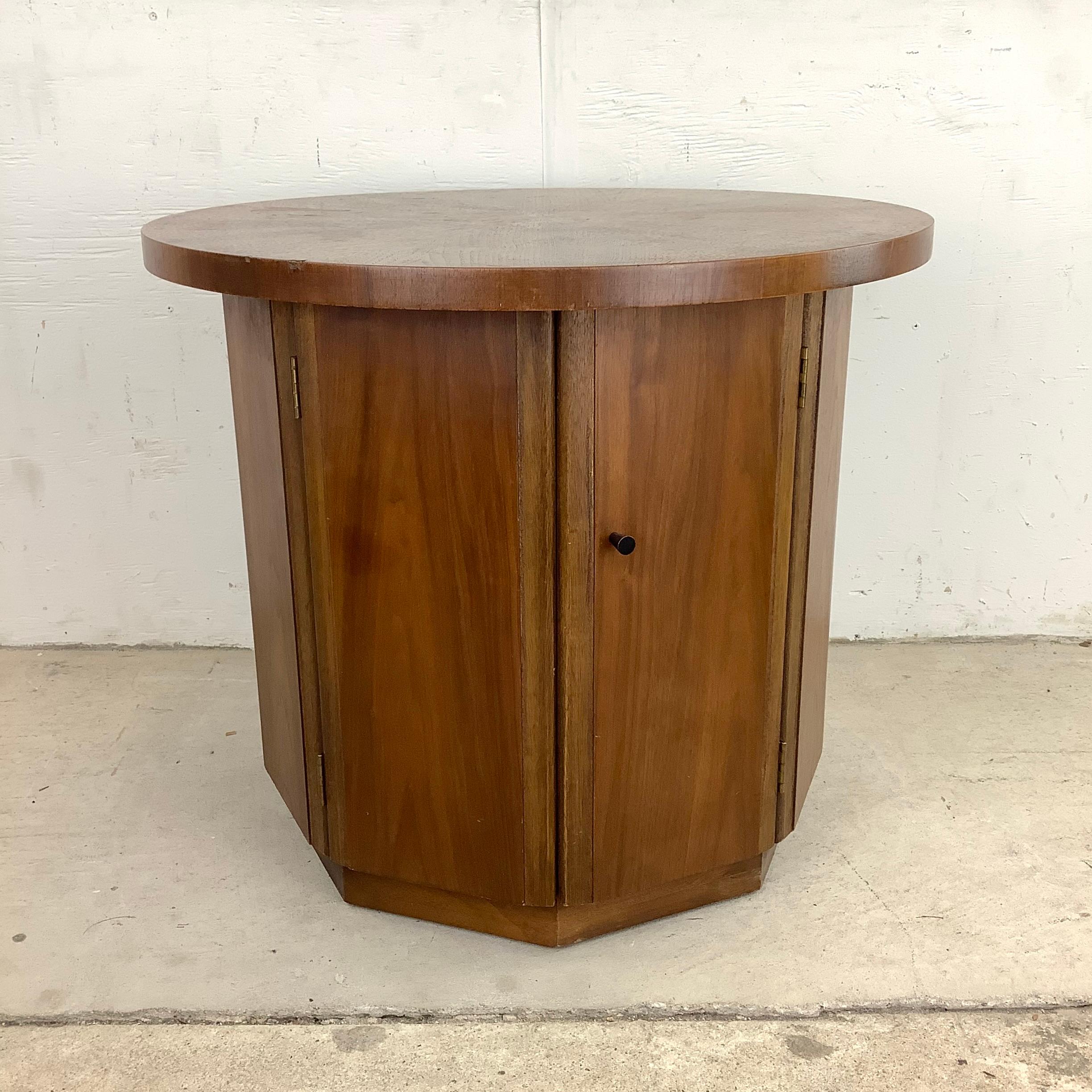 Introducing the Mid-Century Modern Circular Walnut End Table, a stylish and versatile addition to your living space. Crafted with the iconic design elements of the mid-century era, this end table combines sleek lines, warm walnut wood, and a