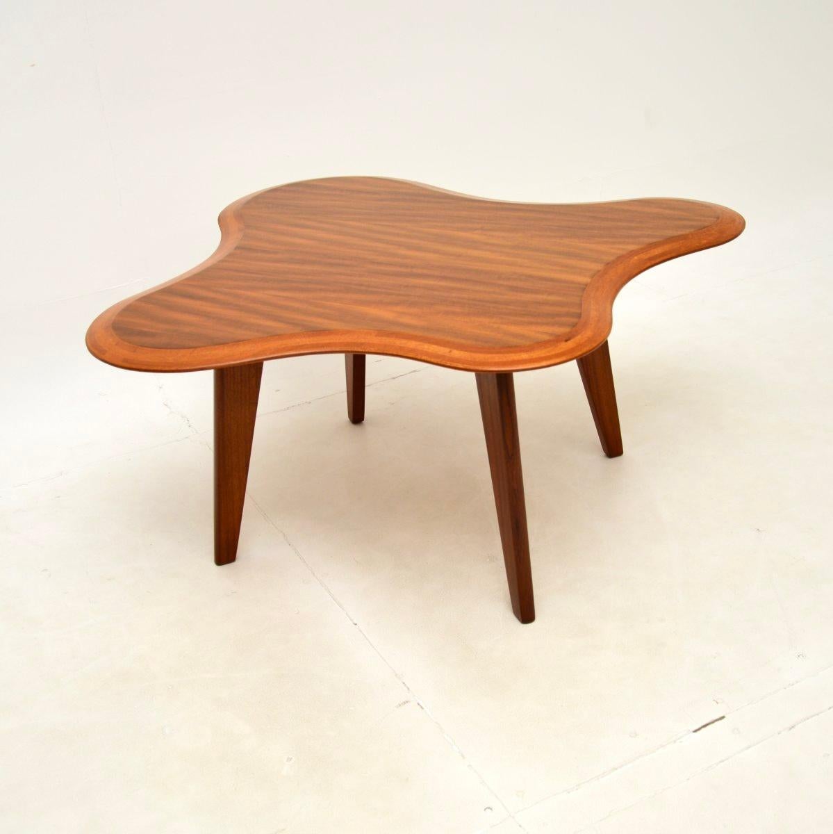 An extremely stylish and iconic design, this is a vintage walnut cloud coffee table by Neil Morris, originally designed in 1947. This example dates from the 1950’s, it was manufactured in Scotland by Morris of Glasgow as part of the Cumbrae