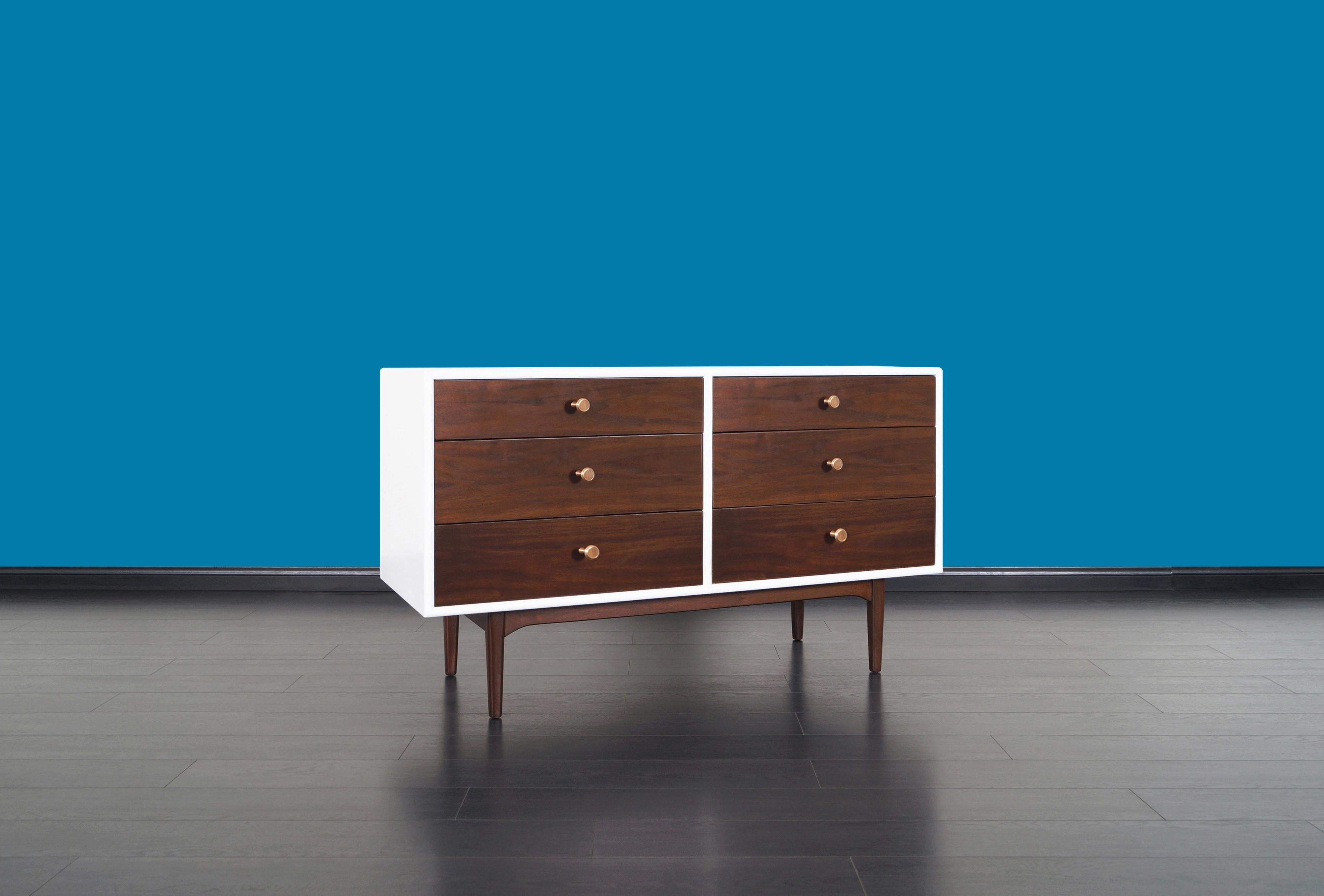 Vintage walnut and lacquered dresser designed by Kipp Stewart and Stewart McDougall for Drexel's Declaration Collection. Exceptional quality dresser constructed from walnut. Features six dovetailed drawers with original brass pulls.