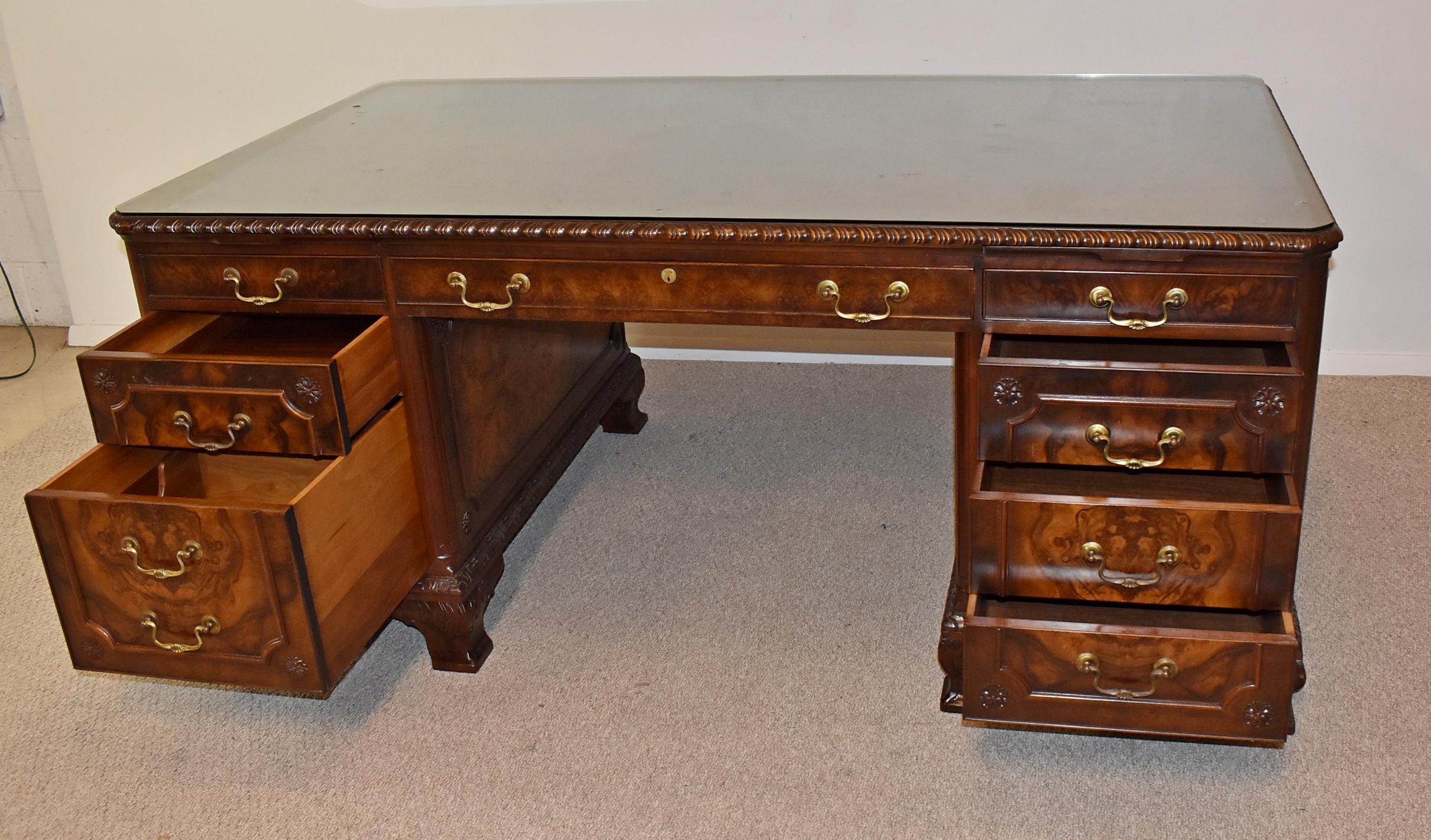 Vintage Walnut Executive Desk. Circa 1930's-1940's. Walnut and burlwood desk with original finish. Locking drawers with keys. Great Vintage condition with minor wear to the top. Manufactured by Wagner-Henzy-Fisher Office Furniture, Cleveland, Ohio