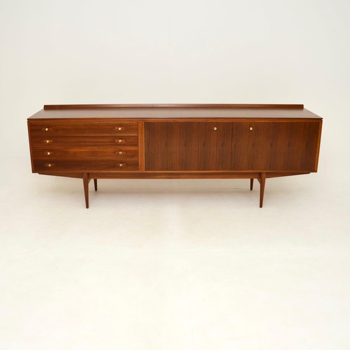 A superb vintage walnut Hamilton sideboard by Robert Heritage for Archie Shine. This was made in England, it dates from the 1960’s.

The quality is outstanding, this won various design awards when it was released in the 1950’s. This is a