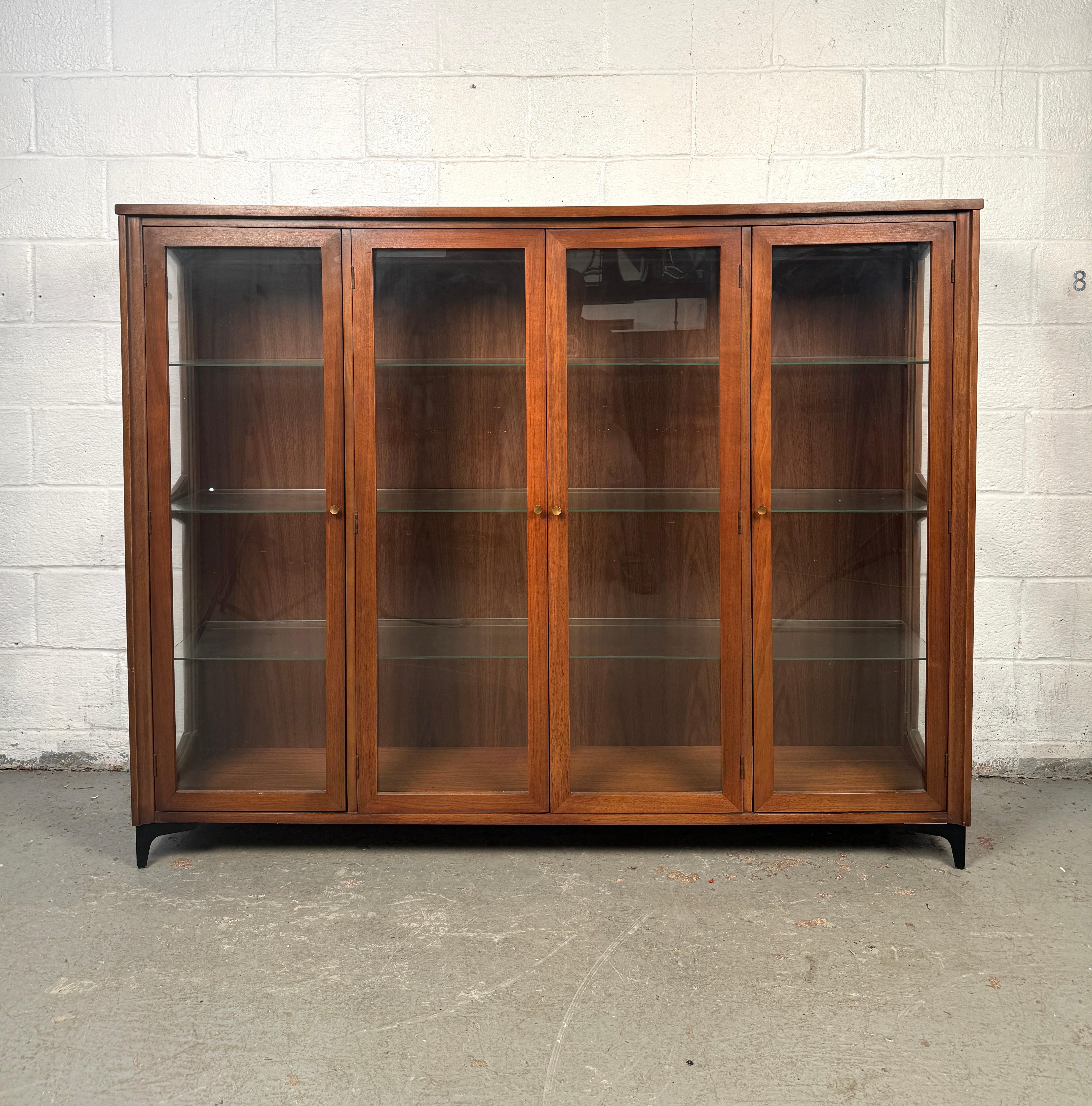 Elevate your storage and display game with this mid-century hutch top, a perfect blend of vintage style and functional elegance. Designed in the classic mid-century modern tradition, this piece features clean lines, warm wood tones, and minimalist