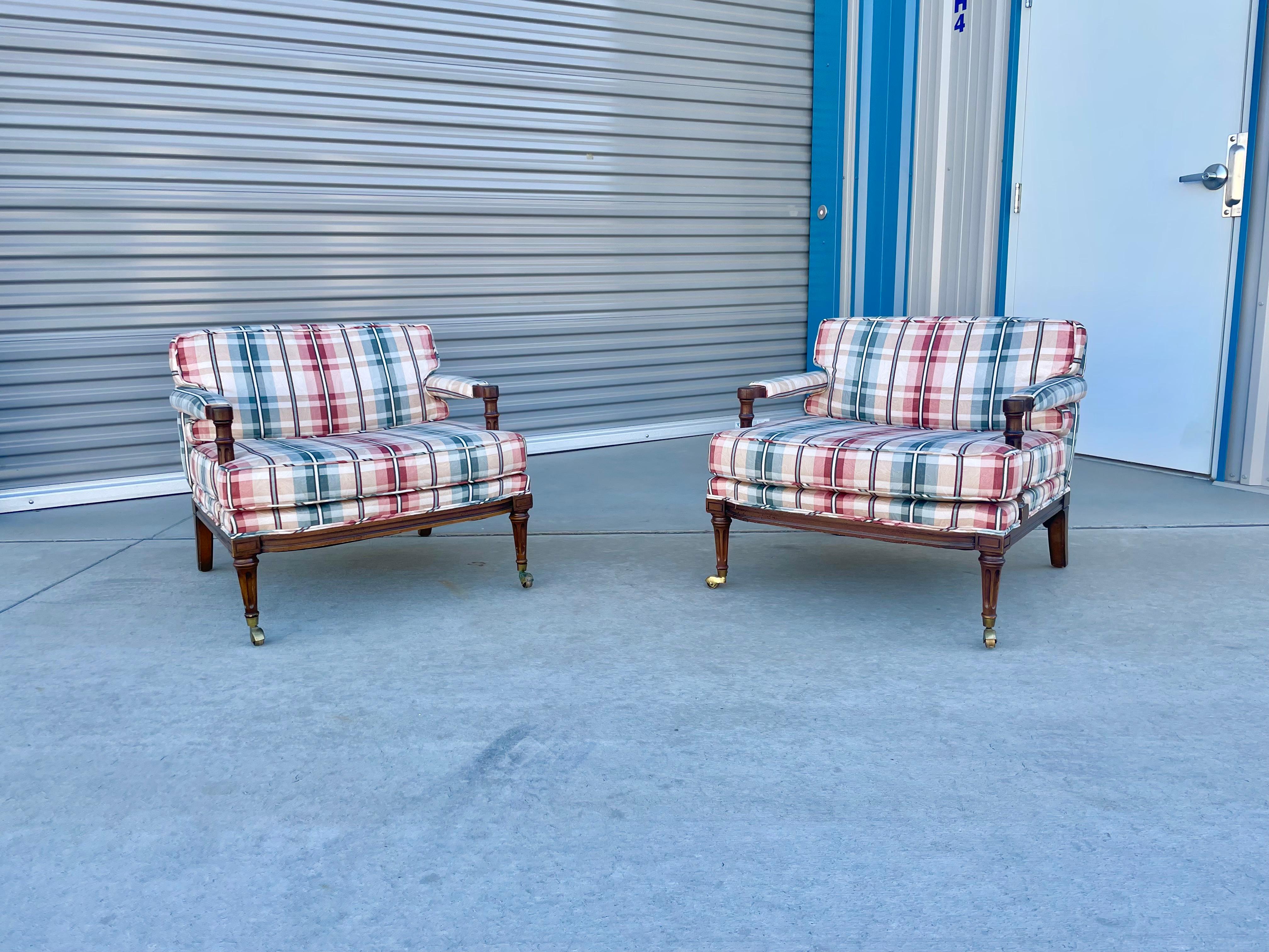 Beautiful vintage pair of lounge chairs designed and manufactured in the United States circa 1930s. These beautiful lounge chairs feature a high back backrest that provides comfort and style. The chair also features a unique sculpture design on the