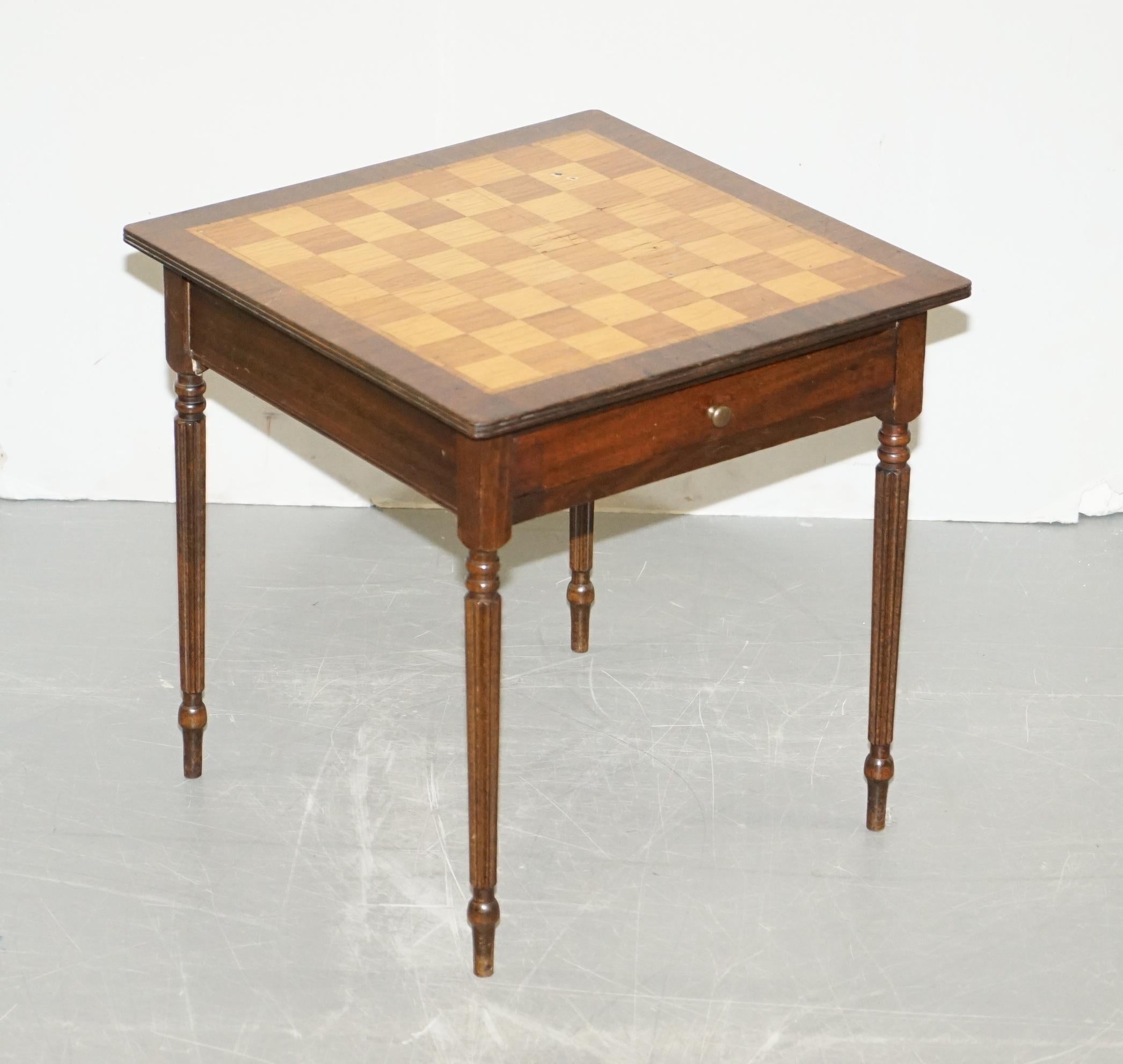 We are delighted to offer for sale this lovely vintage marquetry inlaid Chess board games table

A very good looking well made and function piece of furniture, extremely decorative, the top has nice Walnut & Mahogany timber which beautifully