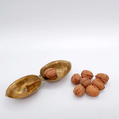 Vintage walnut-shaped brass nutcracker, 1970s Italy