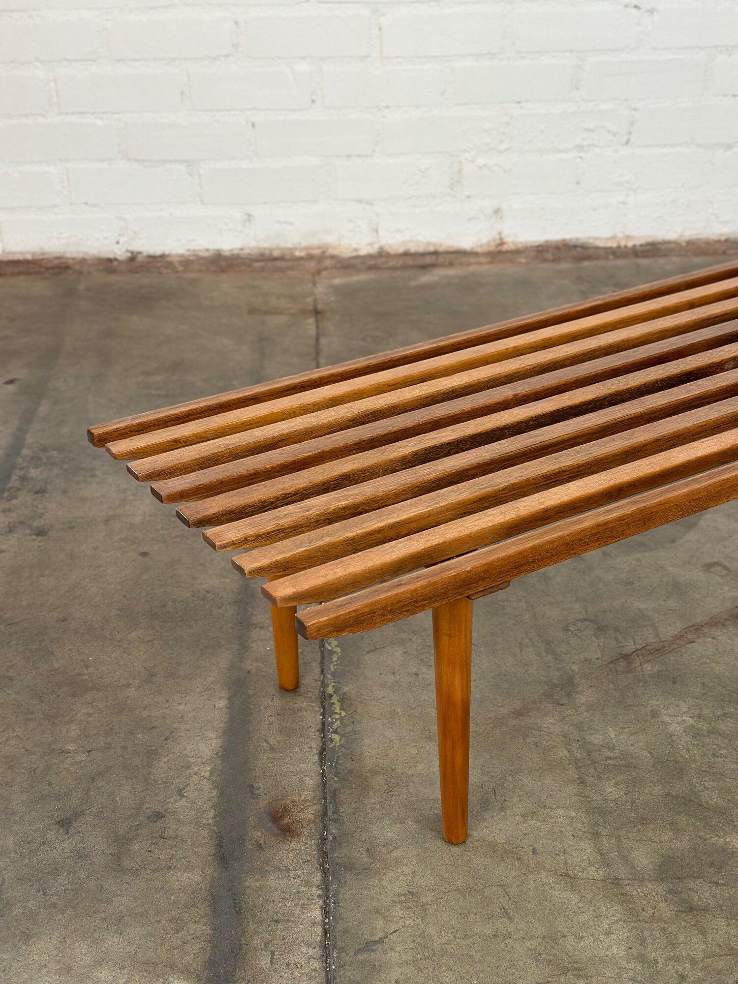 W54 D18 H15

Vintage slat bench refinished and in structurally sound condition. Item shows well with no major areas of wear. Item is vintage, being sold as is, staff has restored to the best of our ability.