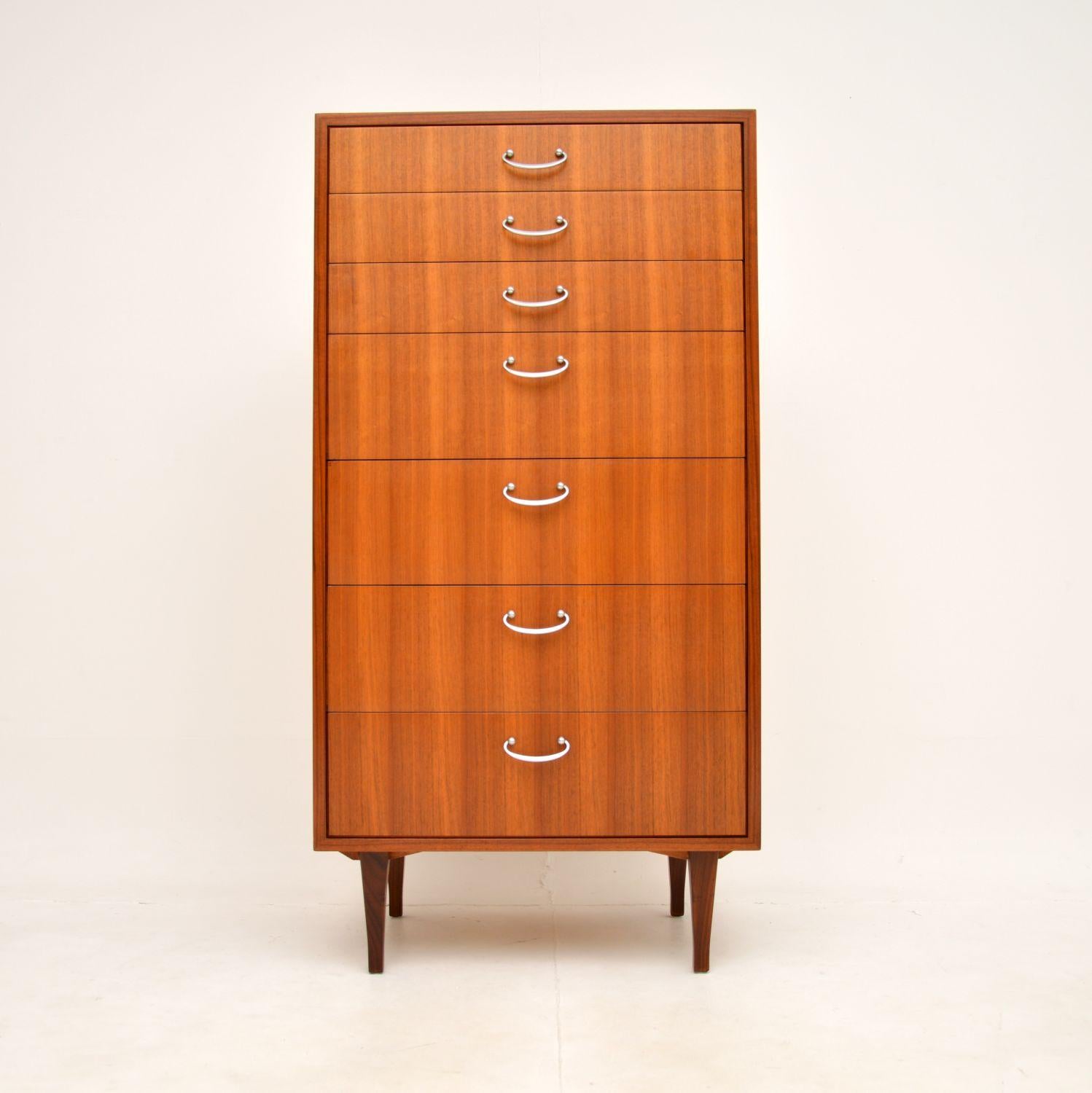 A stylish and very well made vintage walnut tallboy chest of drawers. This was made in England by Meredew, it dates from the 1950-60’s.

It is of superb quality and is a very useful size, offering lots of storage space yet not taking up too much