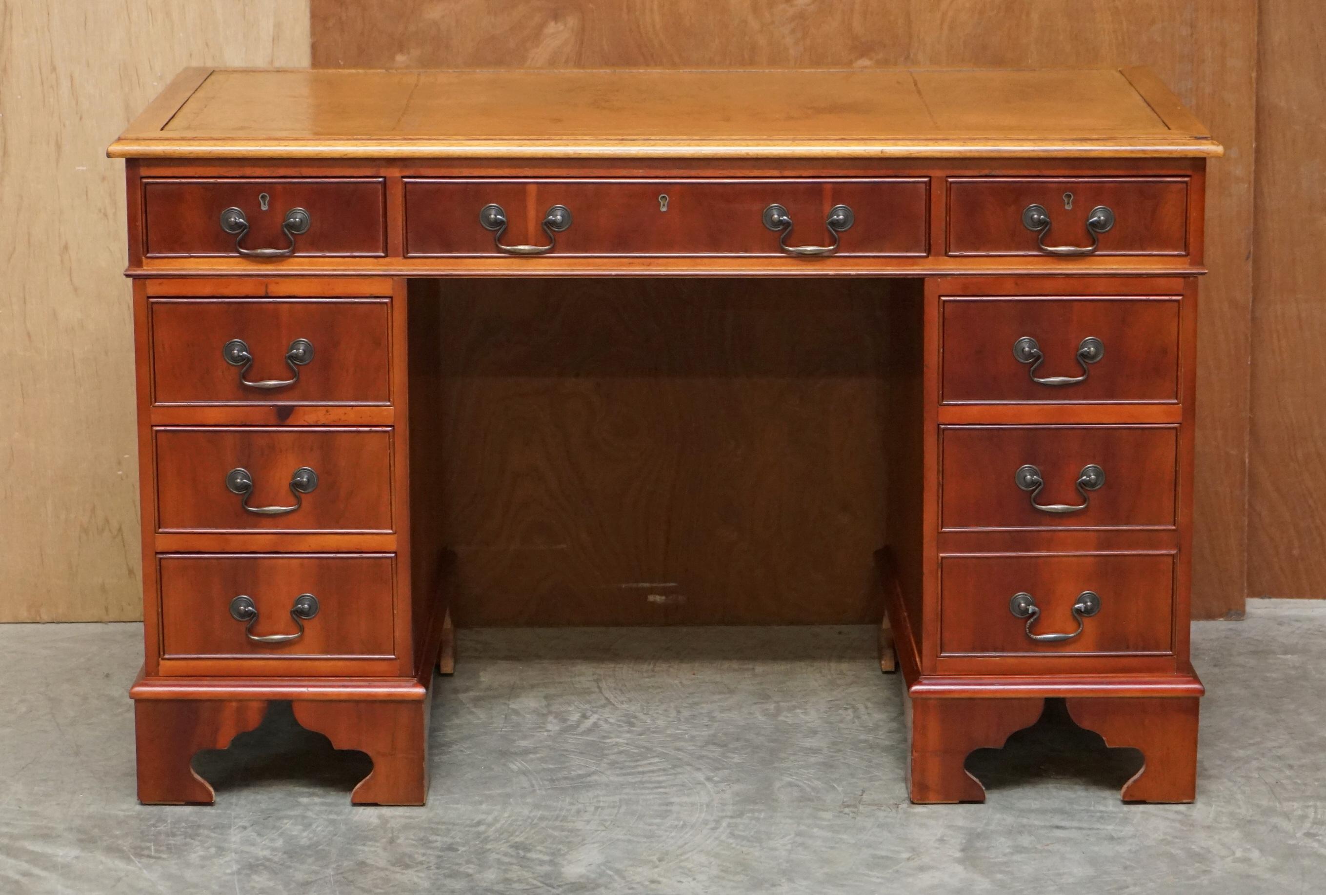 We are delighted to offer for sale this vintage Walnut & Tan Brown leather twin pedestal partner desk 

This is a good looking, well made and decorative piece, the cuts of timber are lovely and have a very English country house look and feel to