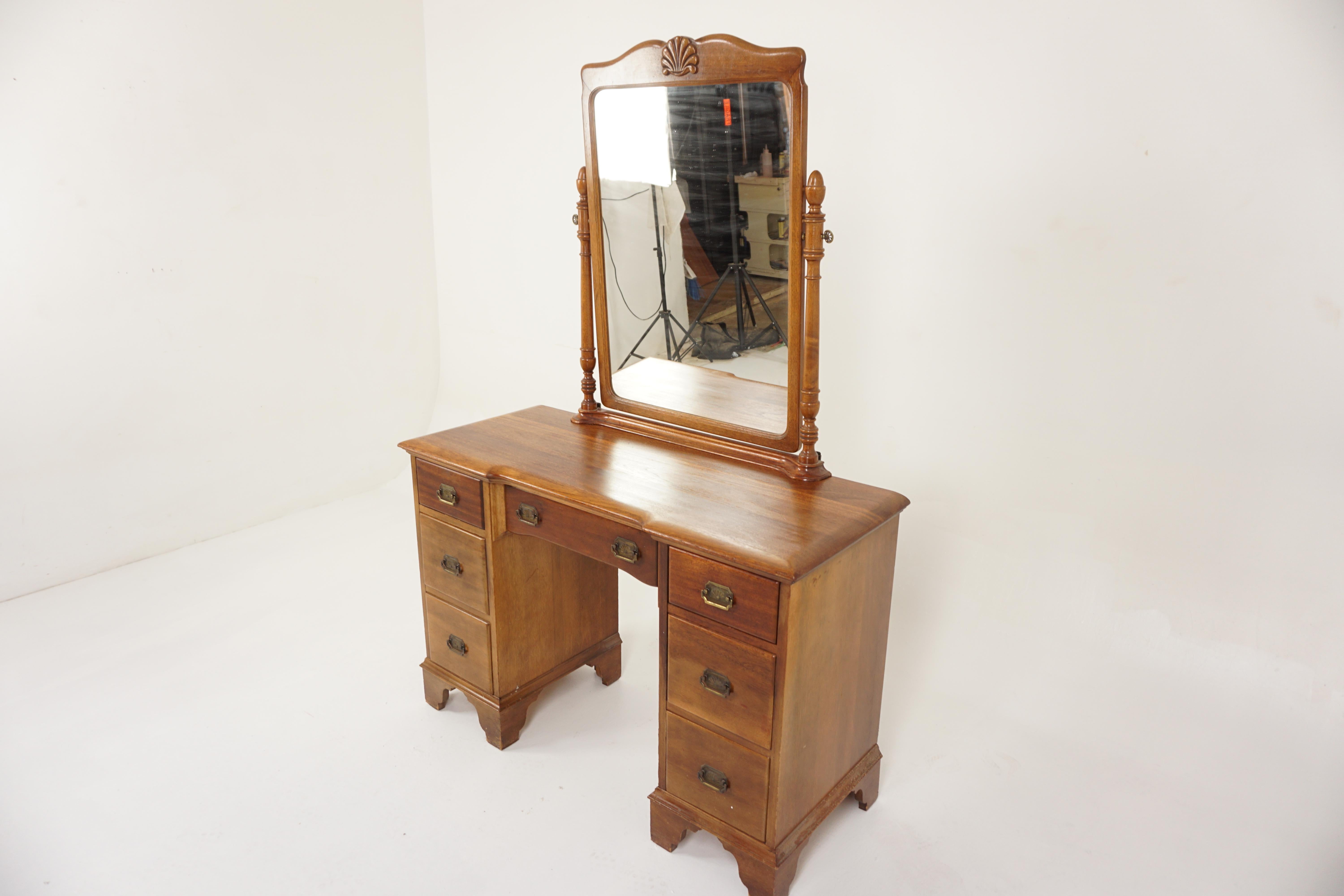 Vintage Walnut Vanity, Dresser with Mirror, Canada 1930, H937

Canada 1930
Solid Walnut
Original Finish
Framed mirror on top six dovetailed graduating drawers
With original brass hardware
Very nice quality and in good