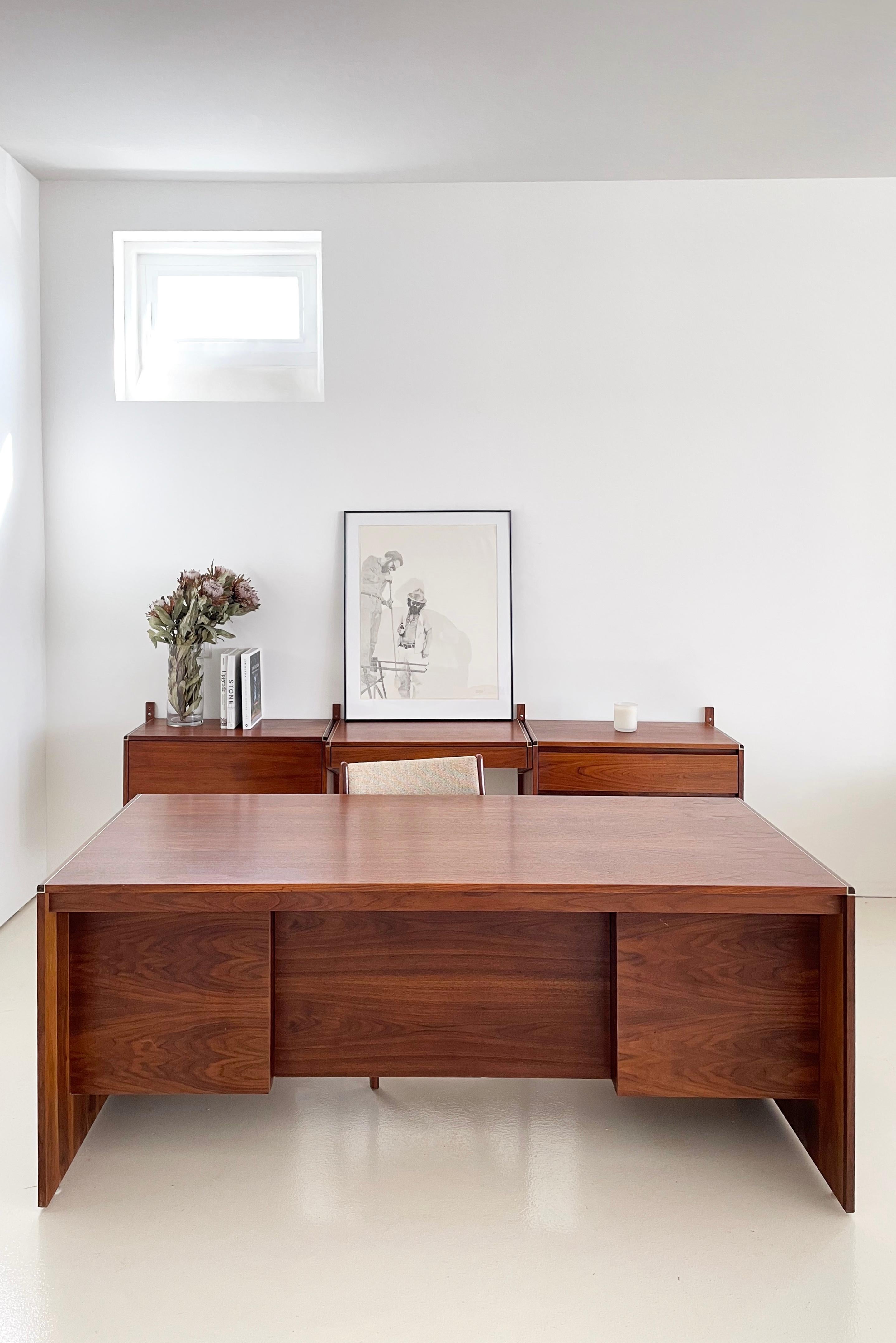 Executive style desk and wall-mounted storage unit (artwork and chair not included) 
Originally manufactured in the 1970s by Barzilay

Exceptionally maintained Walnut veneer and decorative aluminum inlay

All pieces are in excellent with extremely