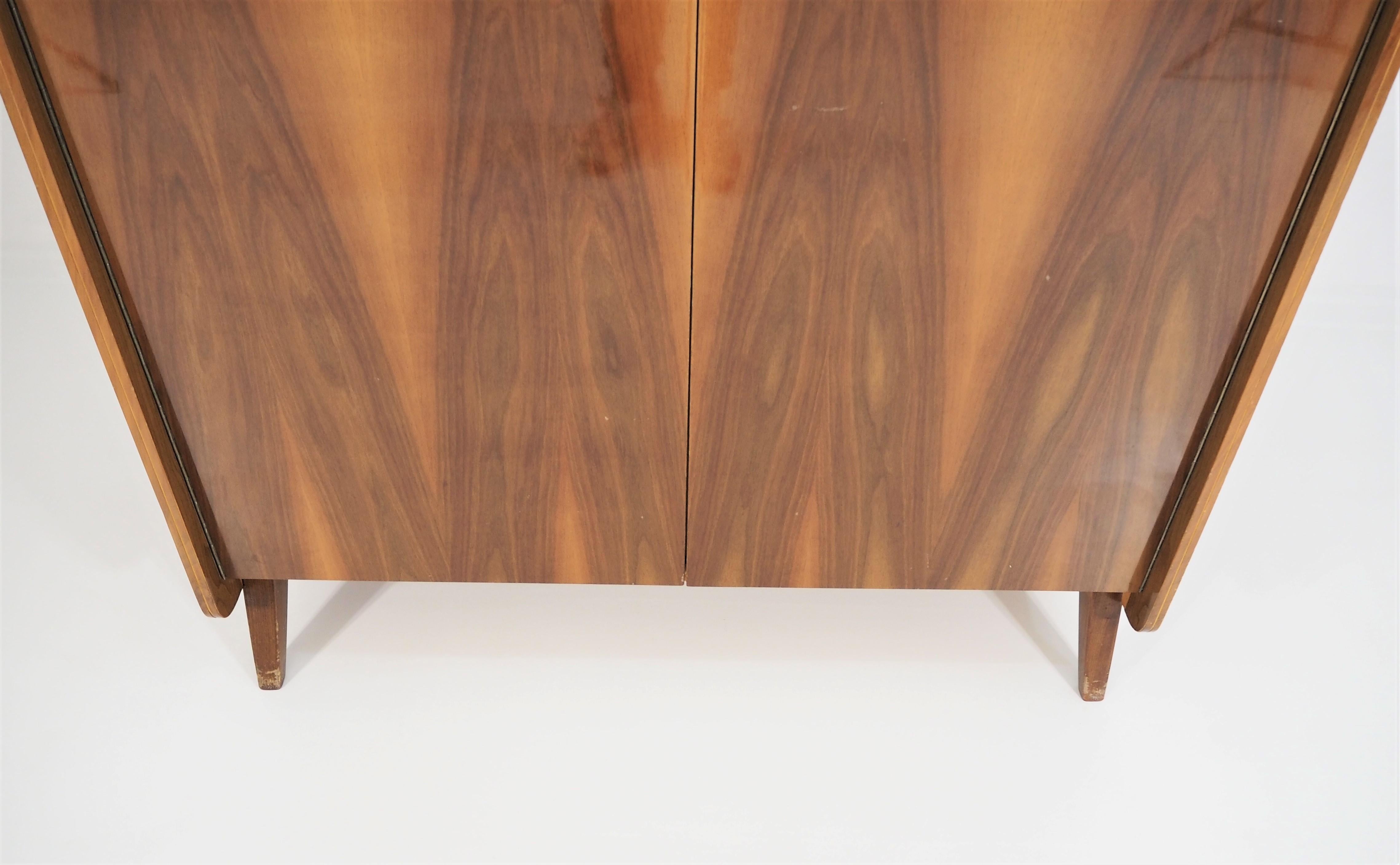 Vintage walnut wardrobe from Tatra, circa 1960s. Very good original condition, beautiful and unique nut veneer. Dimensions: height 171cm, width 118cm, depth 51cm.