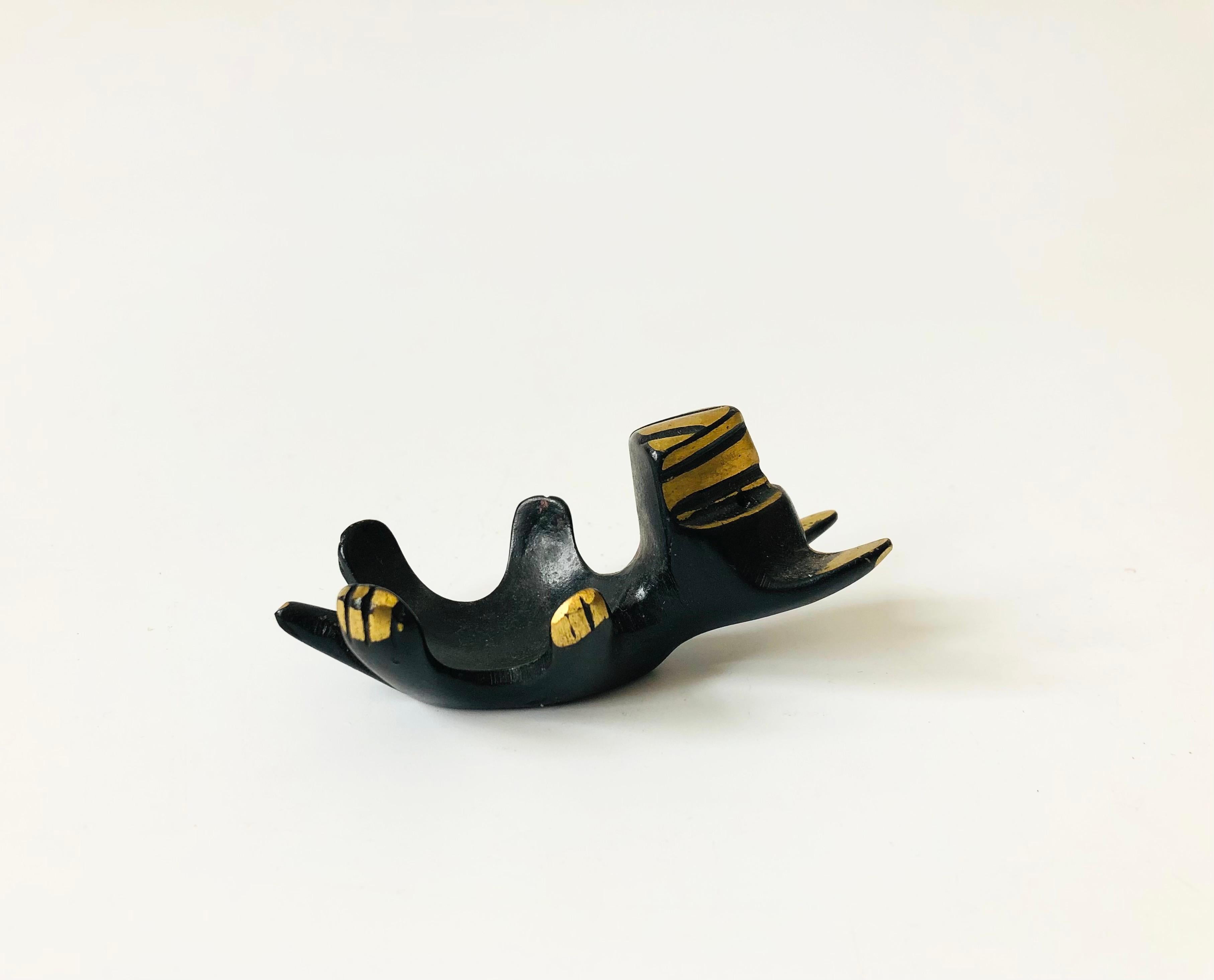 An adorable mid century dog for using as an egg cup or candle holder. Designed by Walter Bosse and made out of heavy two toned patinated brass.
 