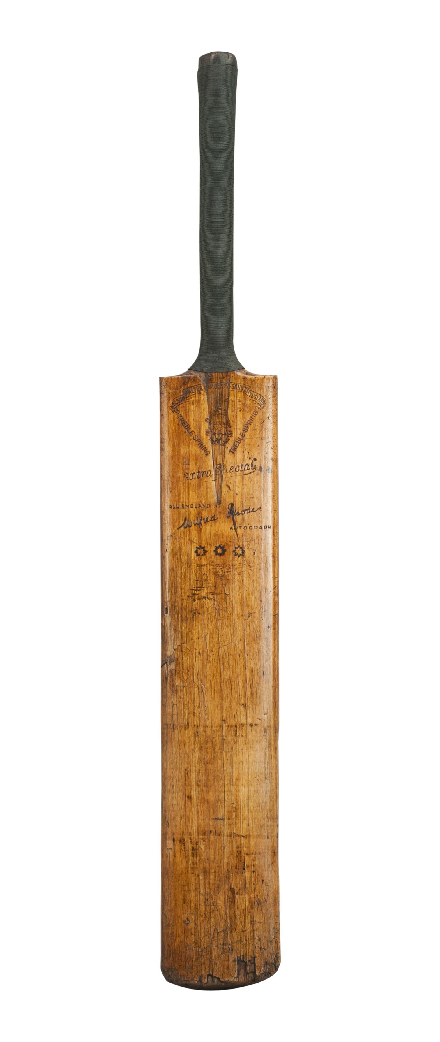 A good cricket bat with nice colour and new cord strung grip. The bat is stamped with the makers name on the top of the blade 'Walter Lambert & Sons Ltd, Nelson England' and their trade mark stamp in the middle of the blade. Embossed on both sides