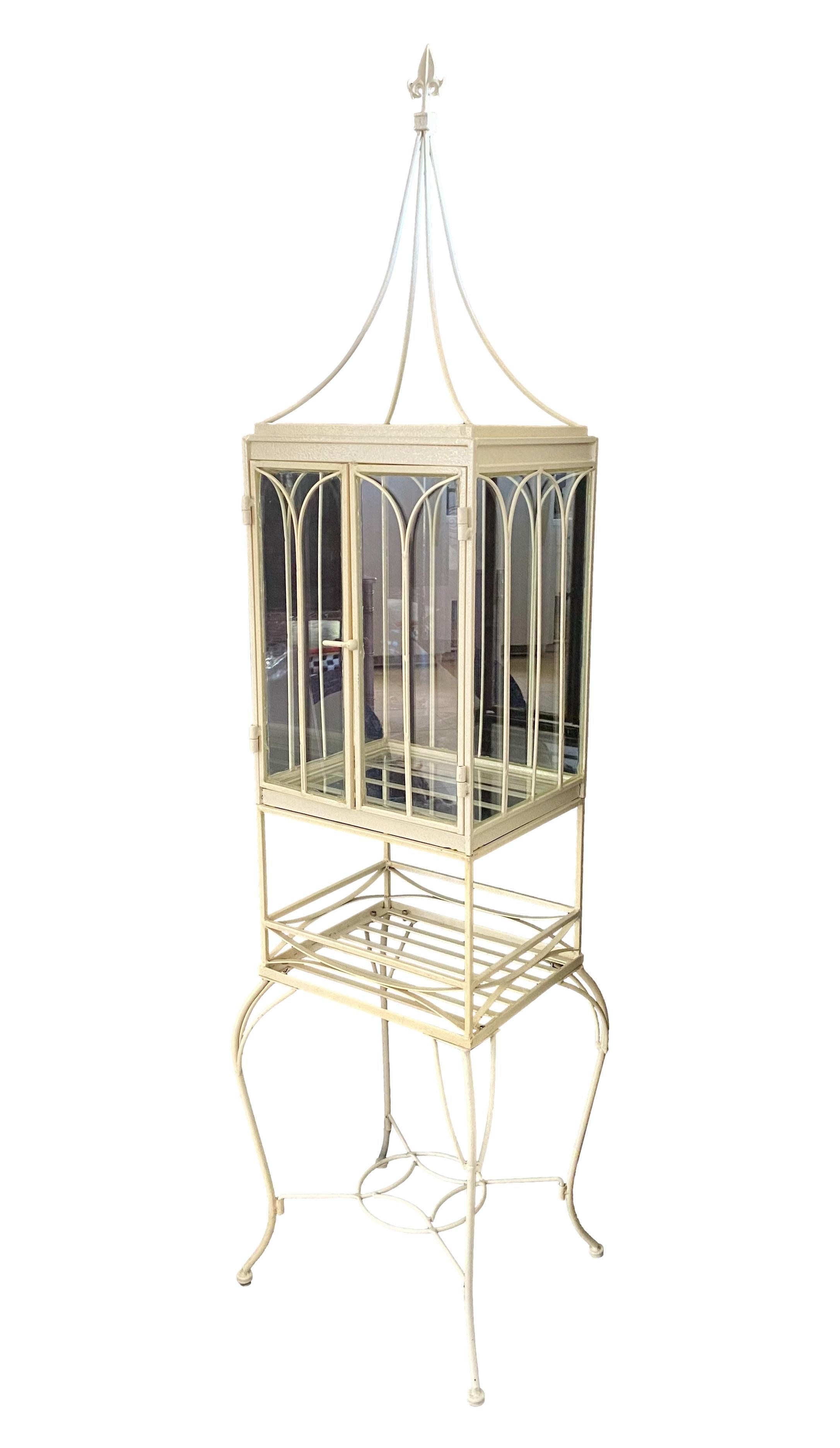 A vintage Victorian style Wardian case or terrarium on stand. Cream coated iron with glass panels.
Can be partially disassembled.

Dimensions: 19