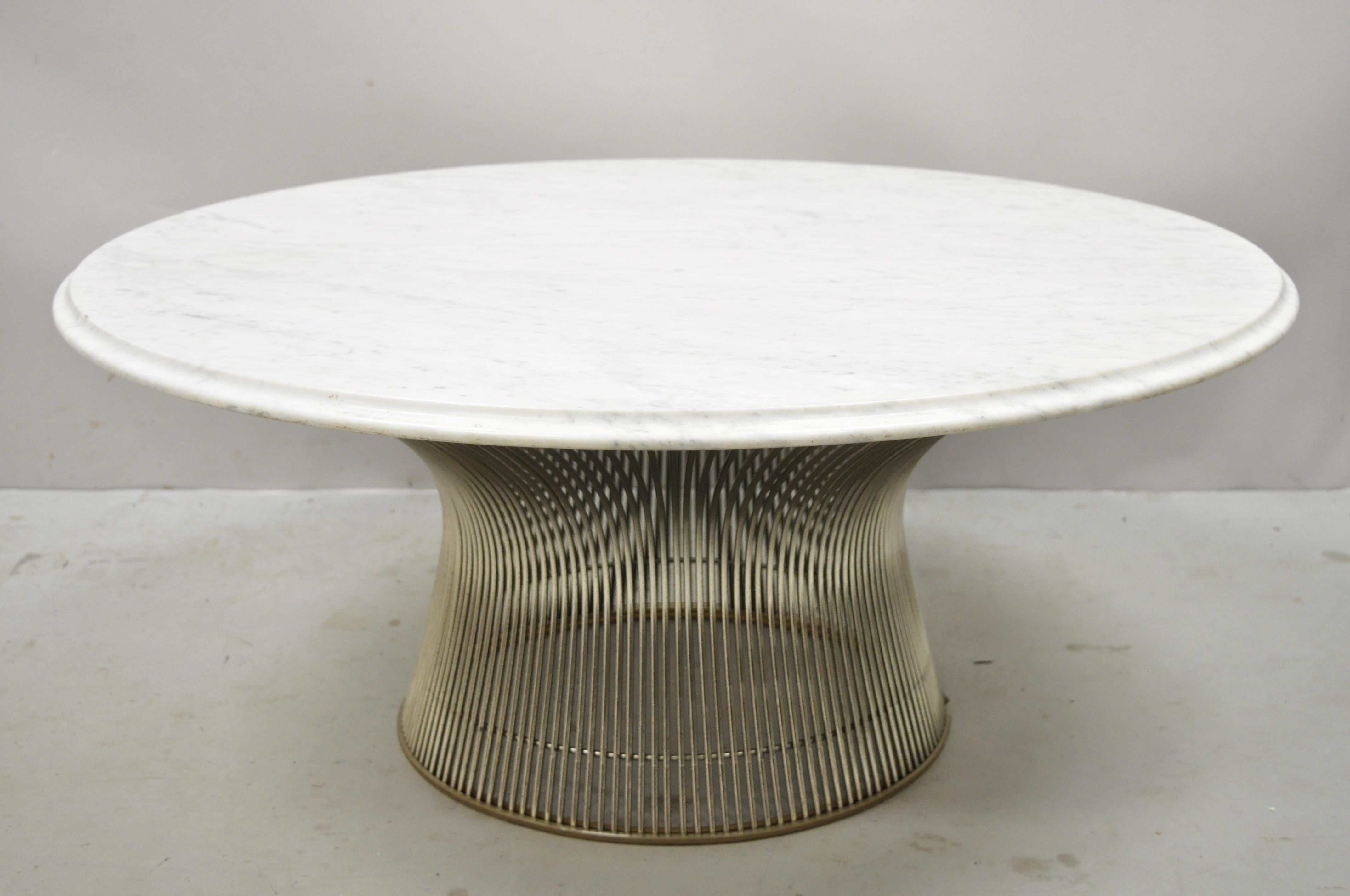 Vintage Warren Platner for Knoll chrome steel wire round marble top coffee table. Item features round white marble top with gray veins and beveled edge, steel wire round pedestal base, very nice vintage item, clean modernist lines, quality American