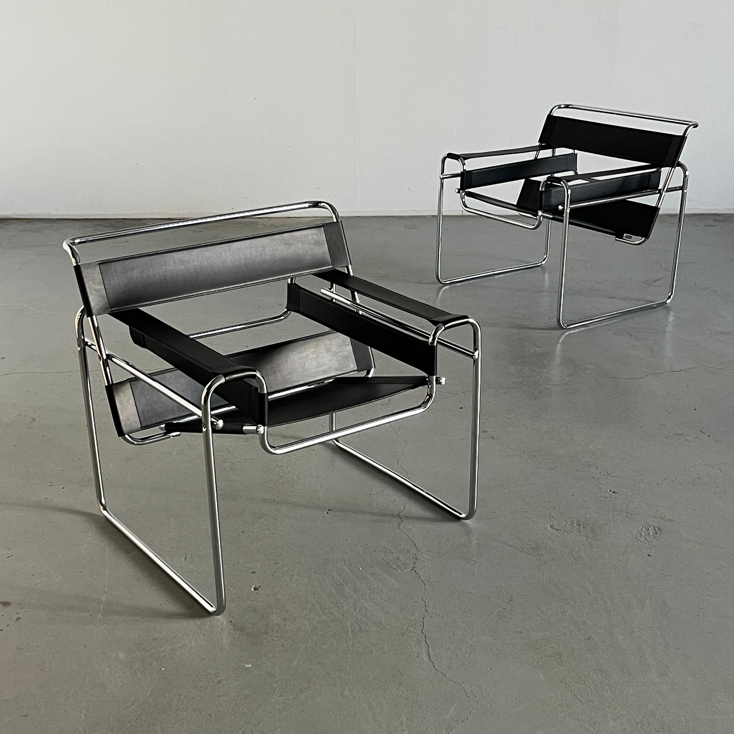 Iconic Wassily armchairs designed by Marcel Breuer in 1925/26, also known as the 'B3' chair.
Unknown but quality vintage Italian production, circa 1970s.

Made from faux leather and chrome.

Overall in very good vintage condition with some expected