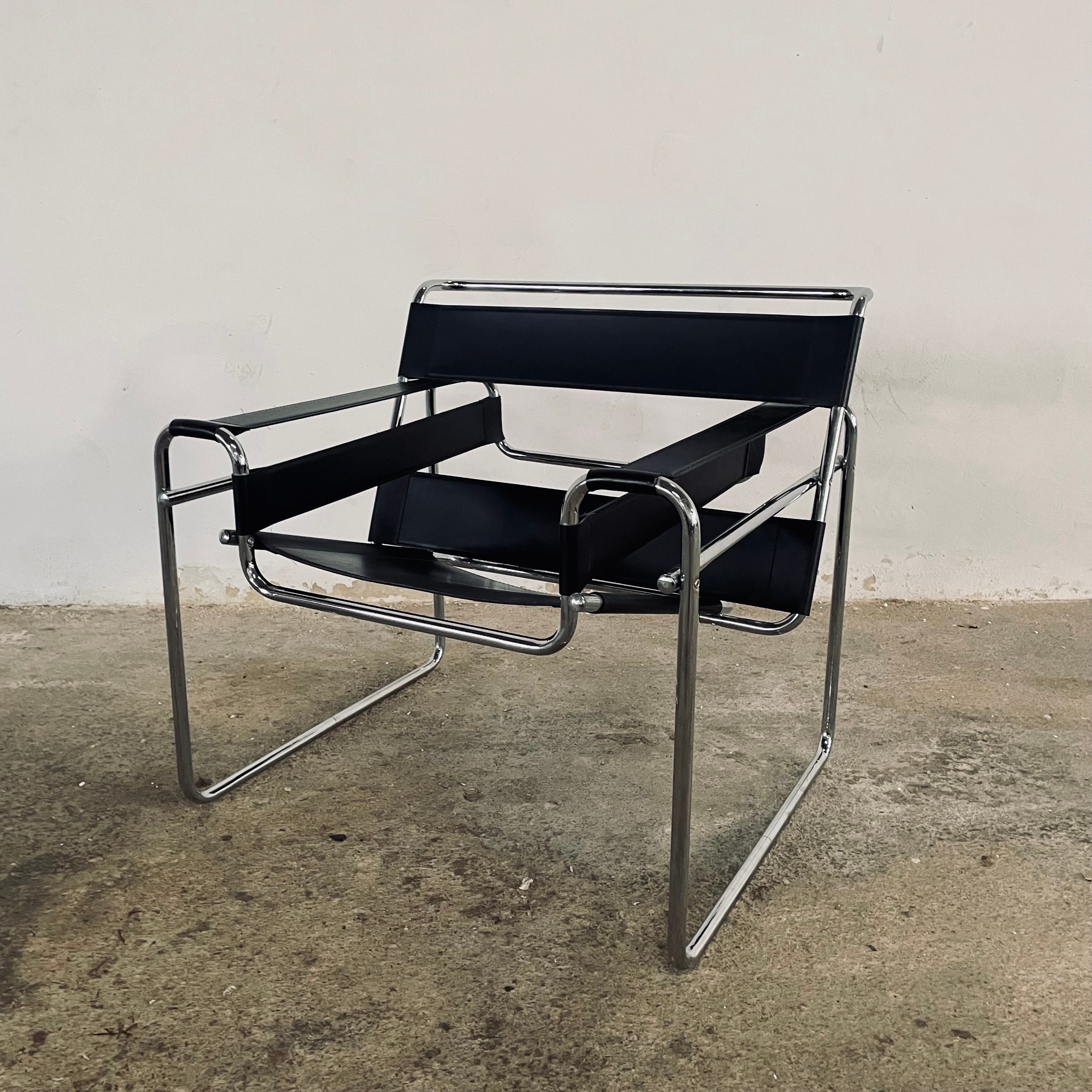 Vintage original condition Wassily chair inspired by the Marcel Breuer for Knoll International A.K.A. B3. Chair, Black Leather and bent Tubular Chrome Steel Arm Chair, Made in Italy circa 1960s
There’s no markings or visible labels present 

This