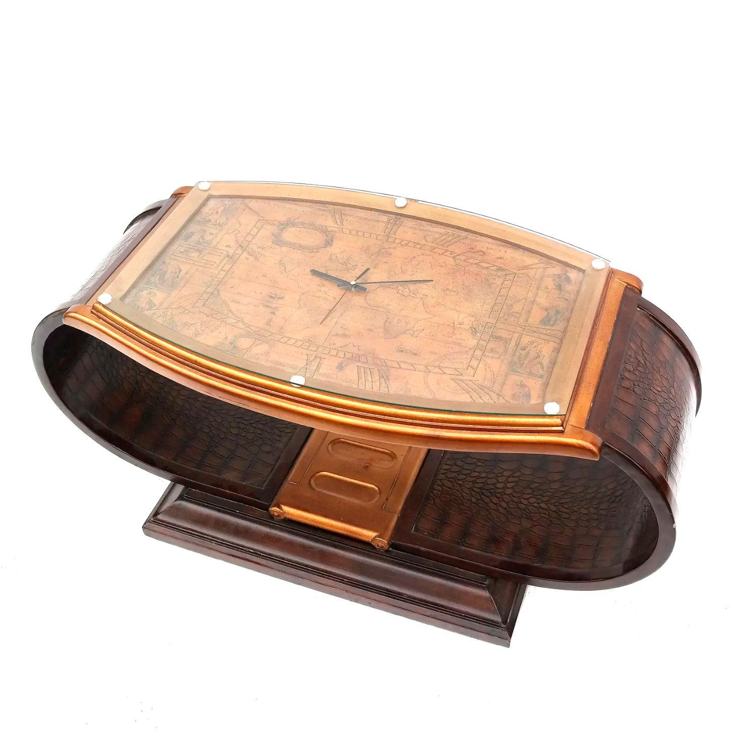 Our fanciful cocktail or coffee table in the form of a wristwatch is masterfully sculpted and finished, with band simulating fine leather, watch face with 18th century map of the world. With original glass top.
