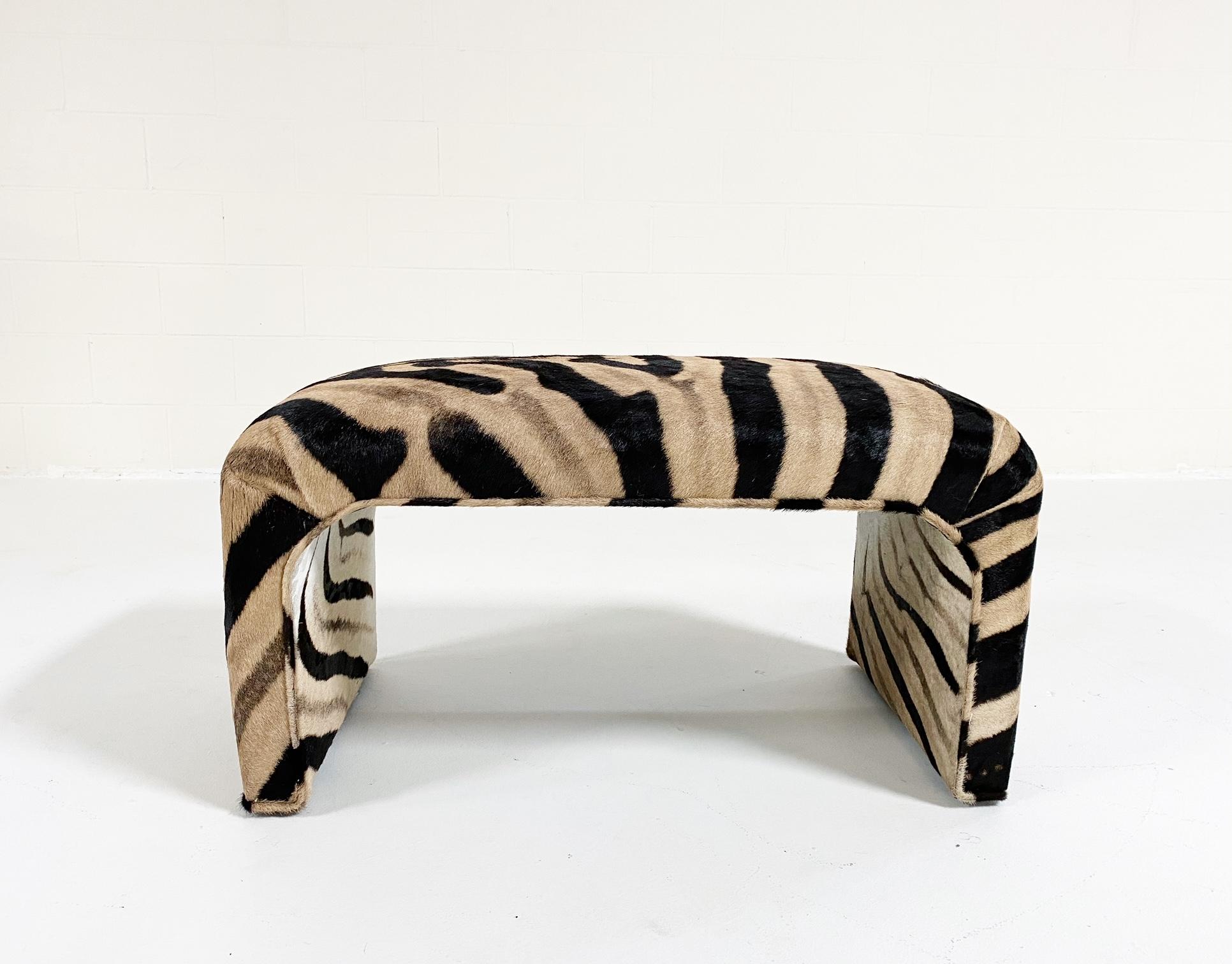 The entire piece has been meticulously reupholstered in zebra hide. It's a beautiful piece and the perfect accent in any room.