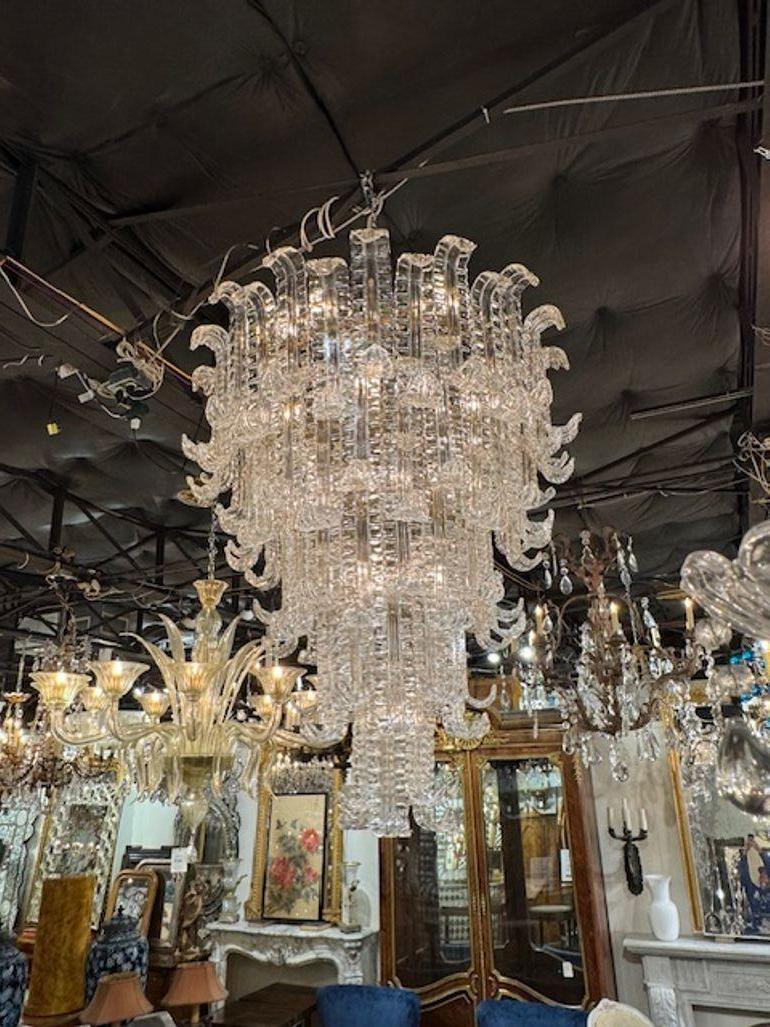 This vintage Waterfall Chandelier is attributed to Barovier, a renowned Italian glassmaking company known for its exquisite craftsmanship. The chandelier features a cascading design reminiscent of a waterfall, creating a stunning visual effect when
