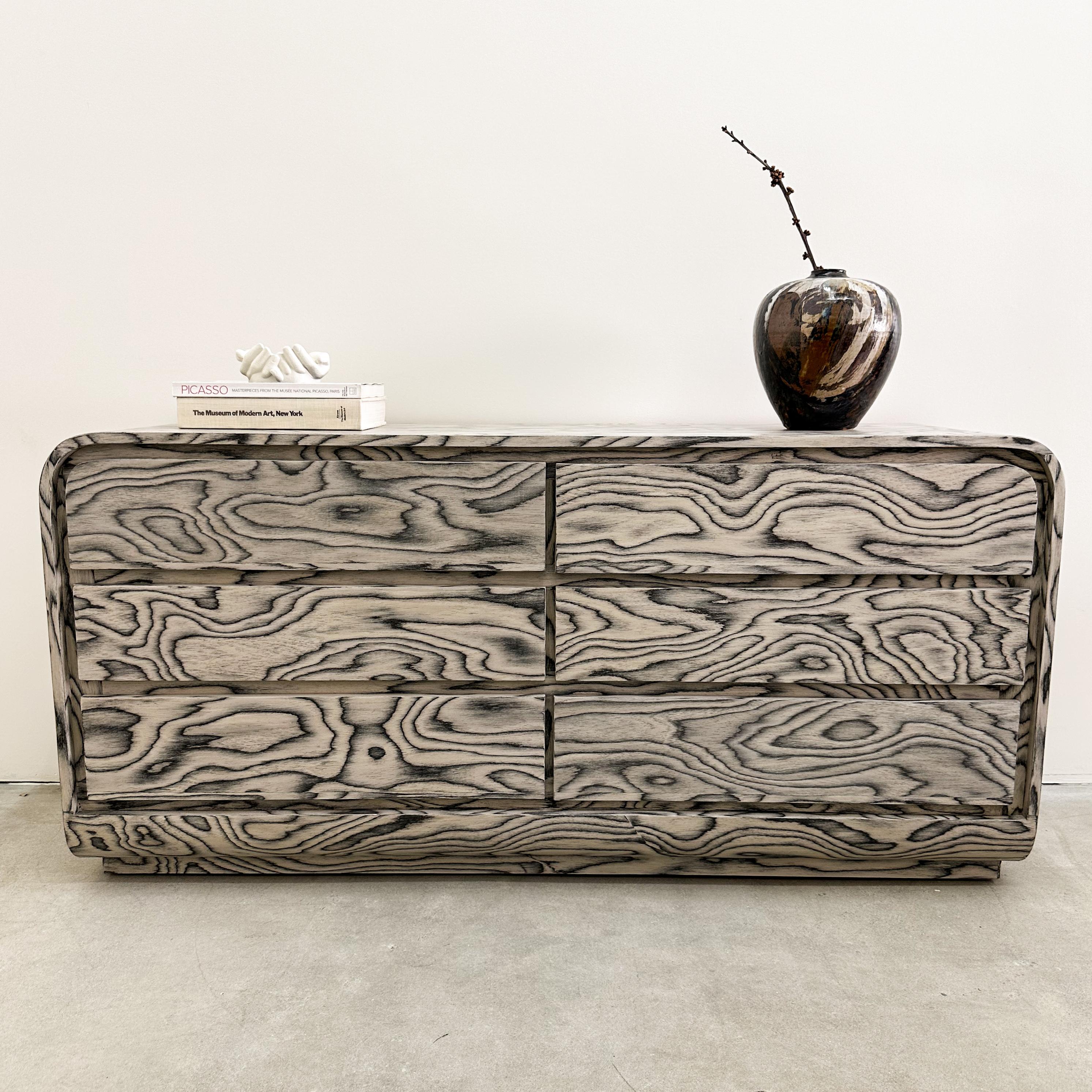 This vintage dresser features re-veneering with the original ALPI veneer, designed by Ettore Sottsass in 1985 an iconic figure in the Memphis design movement. Its distinctive veneer has been sealed with a satin finish to enhance durability. 