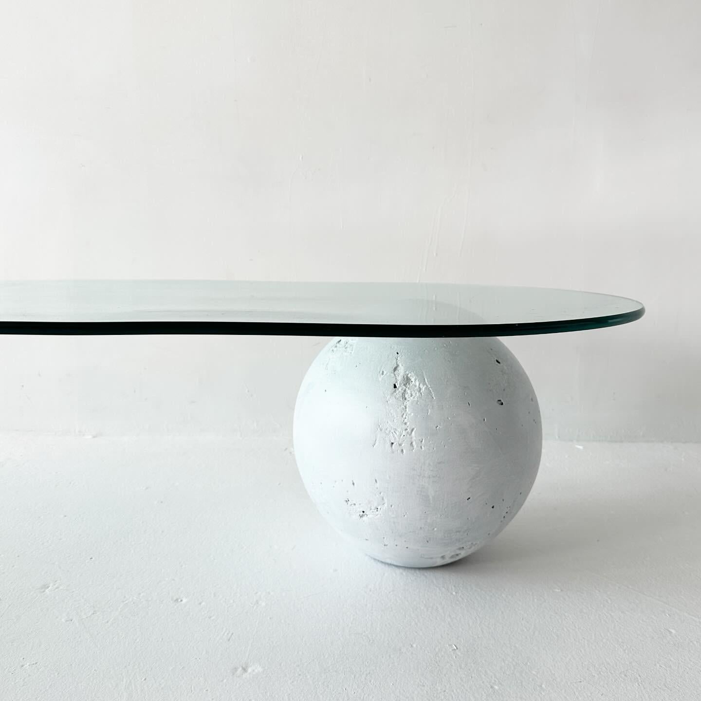 Post-Modern vintage waterfall glass coffee table with painted plaster orb For Sale
