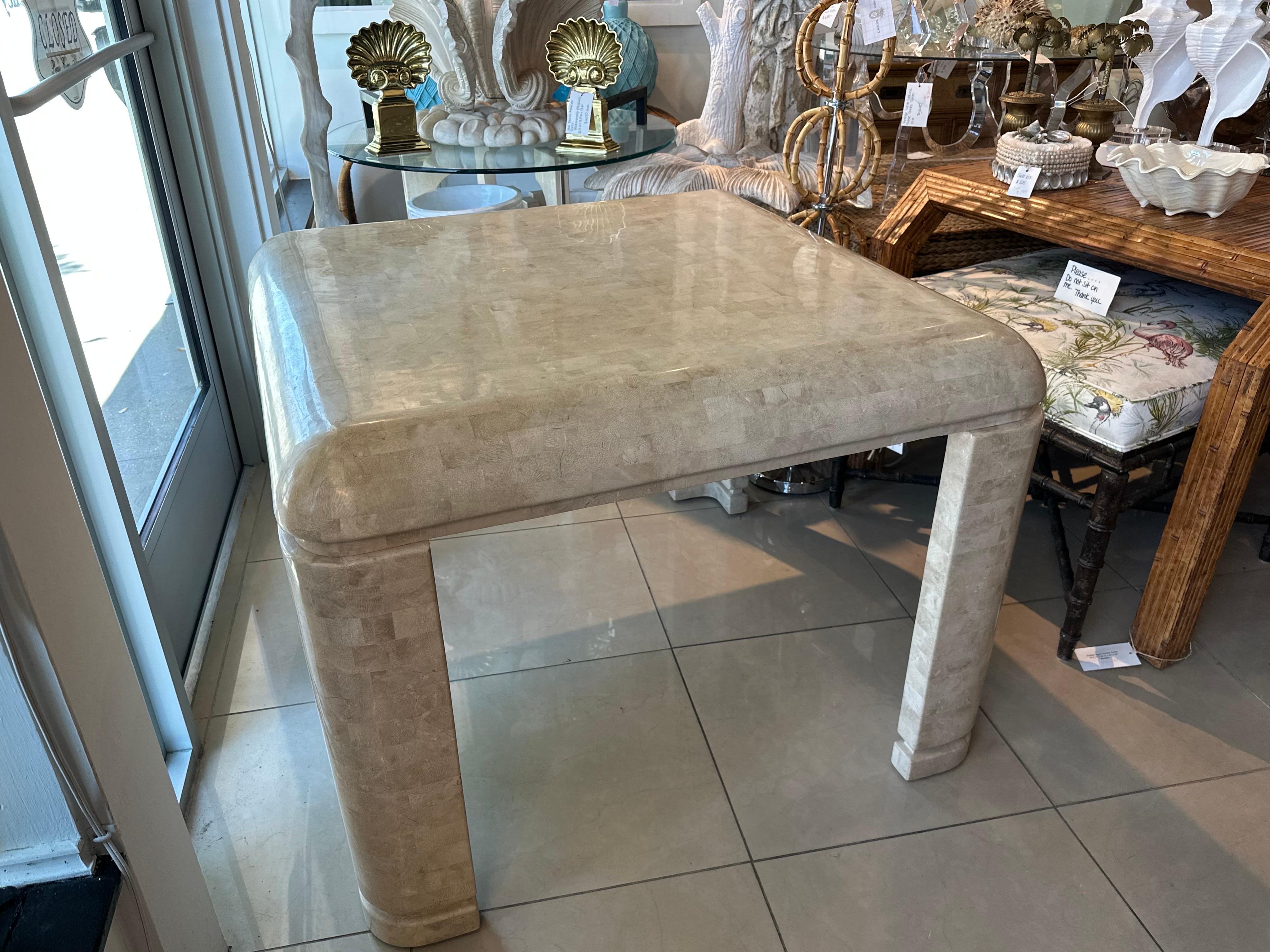 Lovely vintage Maitland Smith tessellated marble stone game or dining table. Waterfall edge. Dimensions: 30 H x 40 W x 40 D. 