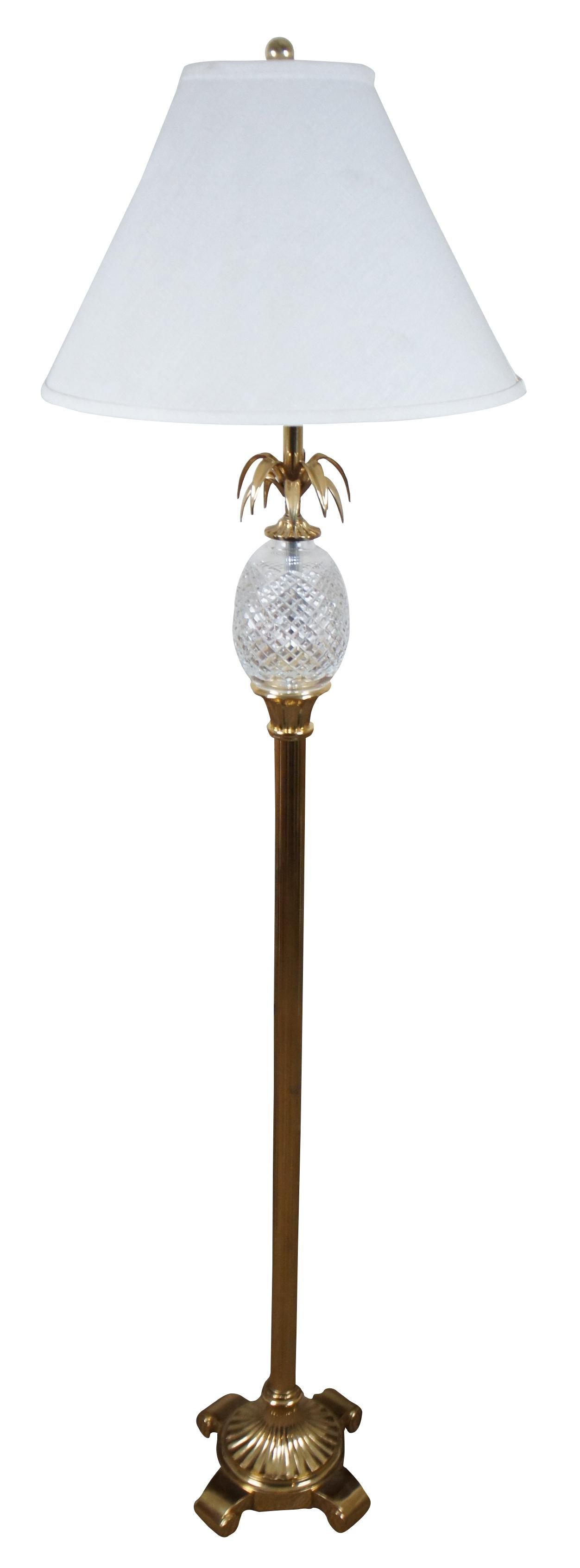 Vintage Waterford Irish crystal floor lamp with neoclassical and Hollywood Regency styling featuring a brass column base, topped with a crystal pineapple with brass leaves, and a white shade.

Measures: 10” x 54.5” / Shade - 17” x 12” / Height to