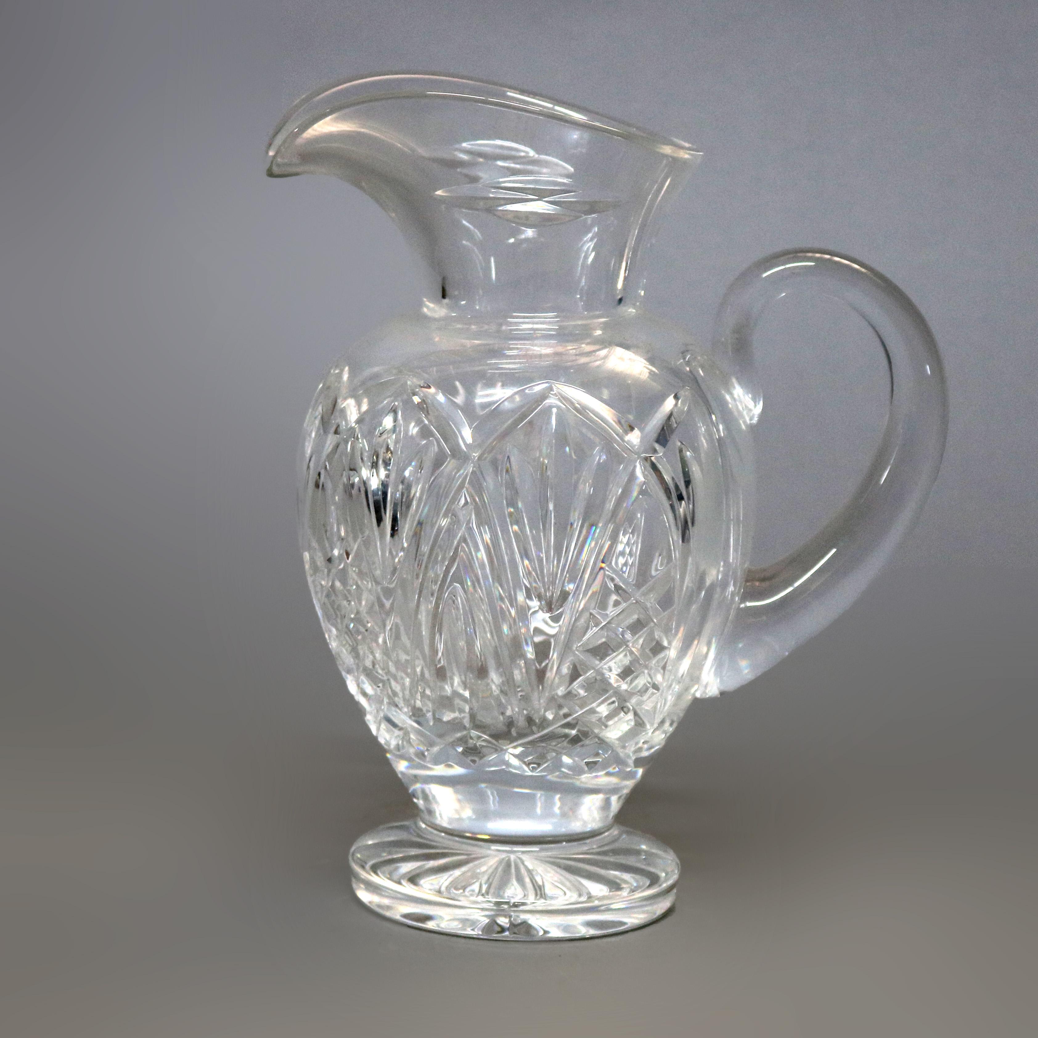 A vintage Waterford Crystal Bunratty Pitcher from the Romance of Ireland Collection offers exaggerated spout over cut crystal bulboul vessel raised on pedestal foot, acid etched Waterford mark on base, 38 oz, 20th cenury

Measures - 9.25