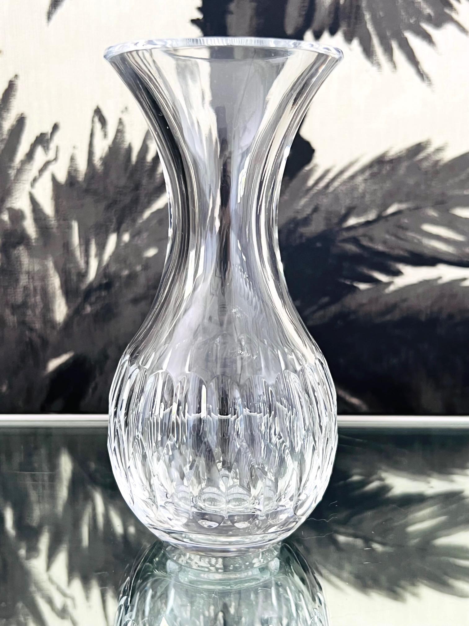1980's Waterford crystal small carafe and decanter. Mouth blown and crafted by hand, the urn shaped carafe has an elongated stem with a bulbous base featuring faceted teardrop pattern with a geometric design. Perfect size for personal use,