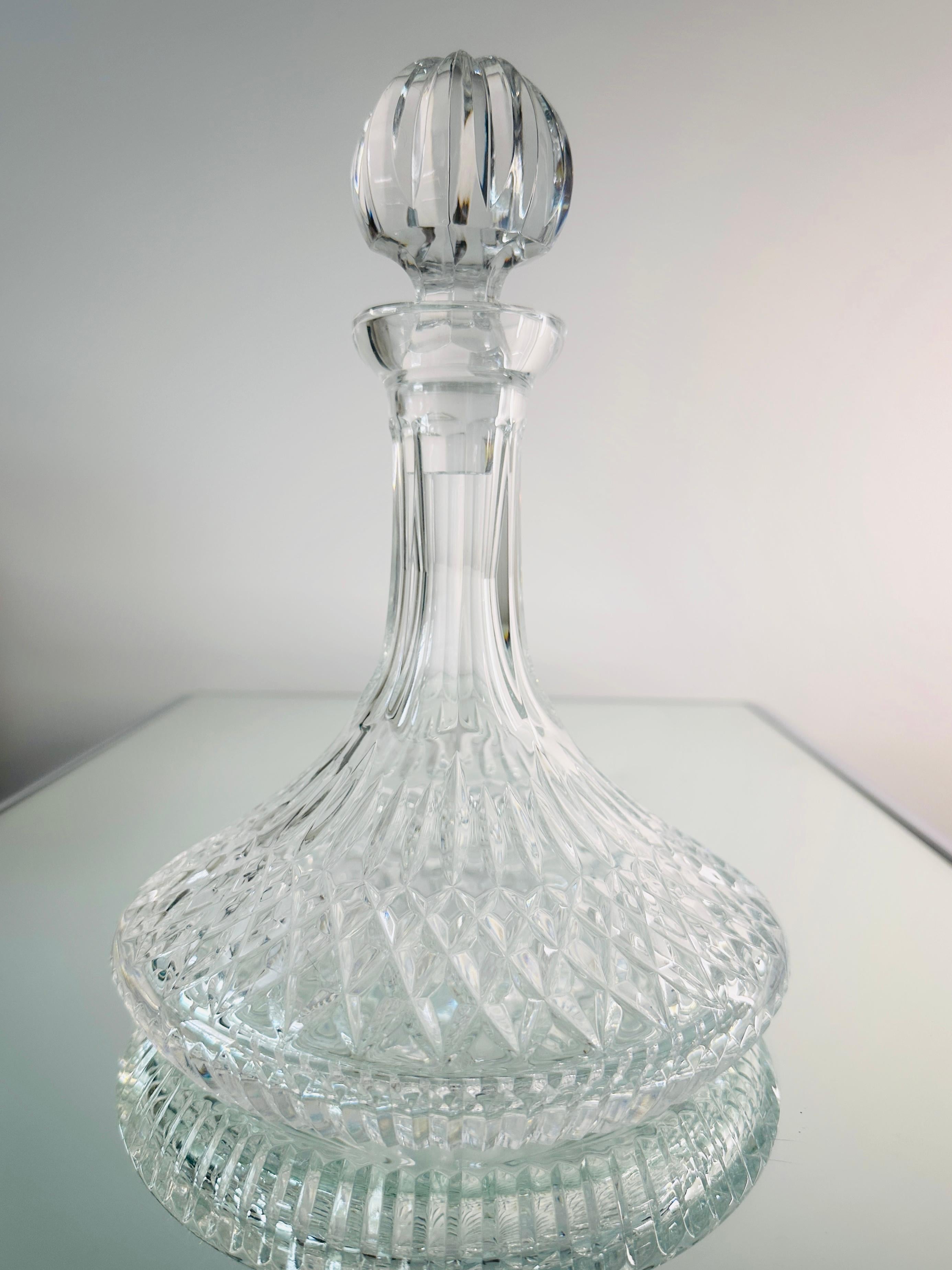 Stunning vintage ships decanters by Waterford Crystal from the classic Lismore Series, first introduced in the early 1950's.  Handcrafted and mouth-blown lead crystal featuring brilliant prismatic diamond cuts with etched designs throughout.  Also