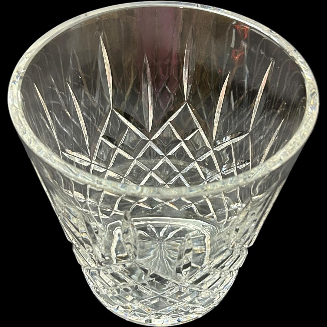 This vintage Waterford “Lismore” crystal ice bucket is a stunning piece that will add a touch of elegance to any gathering.  Crafted in Ireland, this round ice bucket features a beautiful pattern with diamond cuts and is made of high-quality crystal