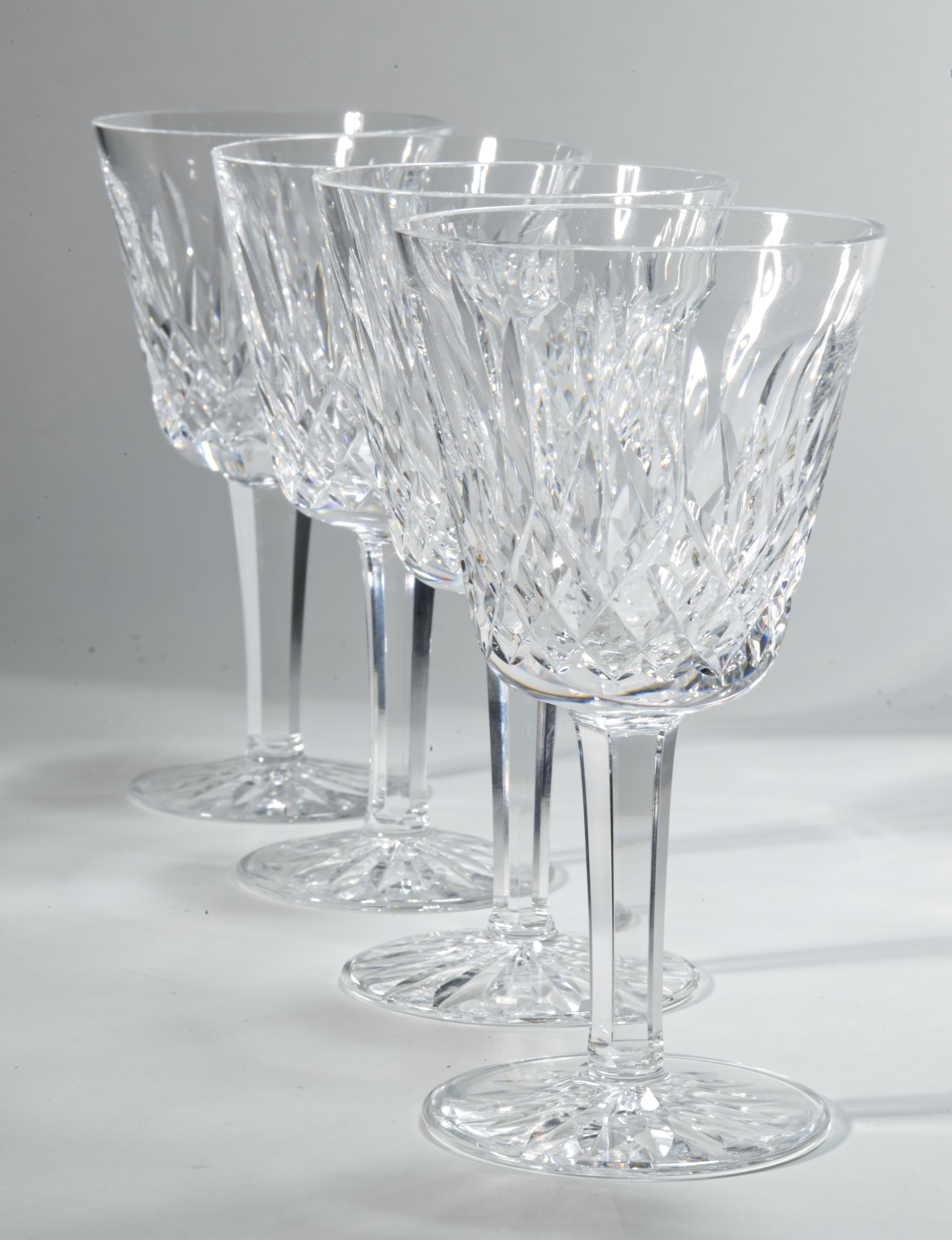  The set of 4 wine glasses in Lismore pattern is in very good vintage condition. The glasses are standing 5, 7/8