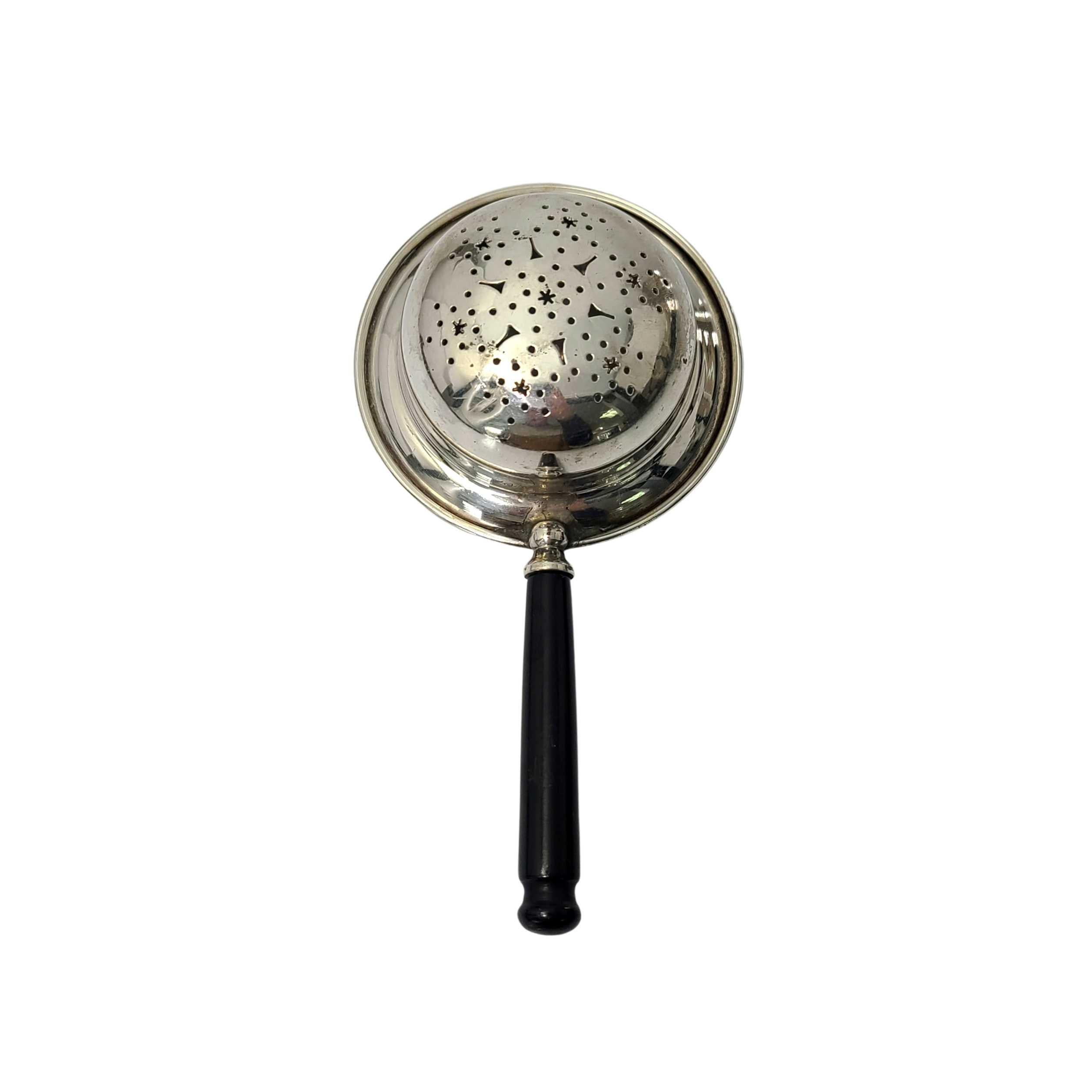 Vintage sterling silver tea strainer by Watson #47.

Watson was active from 1880-1955 specializing in souvenir spoons, vanity and novelty items. This tea strainer features a black handle and a pierced star design in the bowl.

Measures