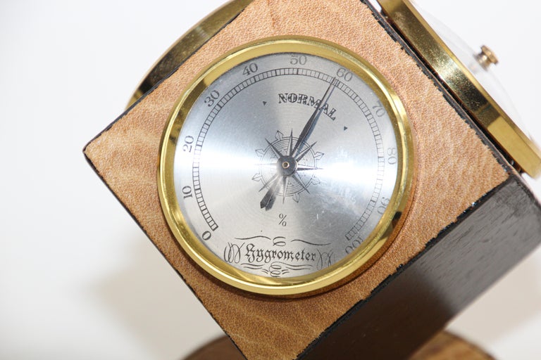 https://a.1stdibscdn.com/vintage-weather-station-rotated-cube-with-barometer-thermometer-and-hygrometer-for-sale-picture-4/f_9068/f_267927321641518318099/Barometer_and_desk_cloack_with_leather_West_Germany_4_master.jpg?width=768