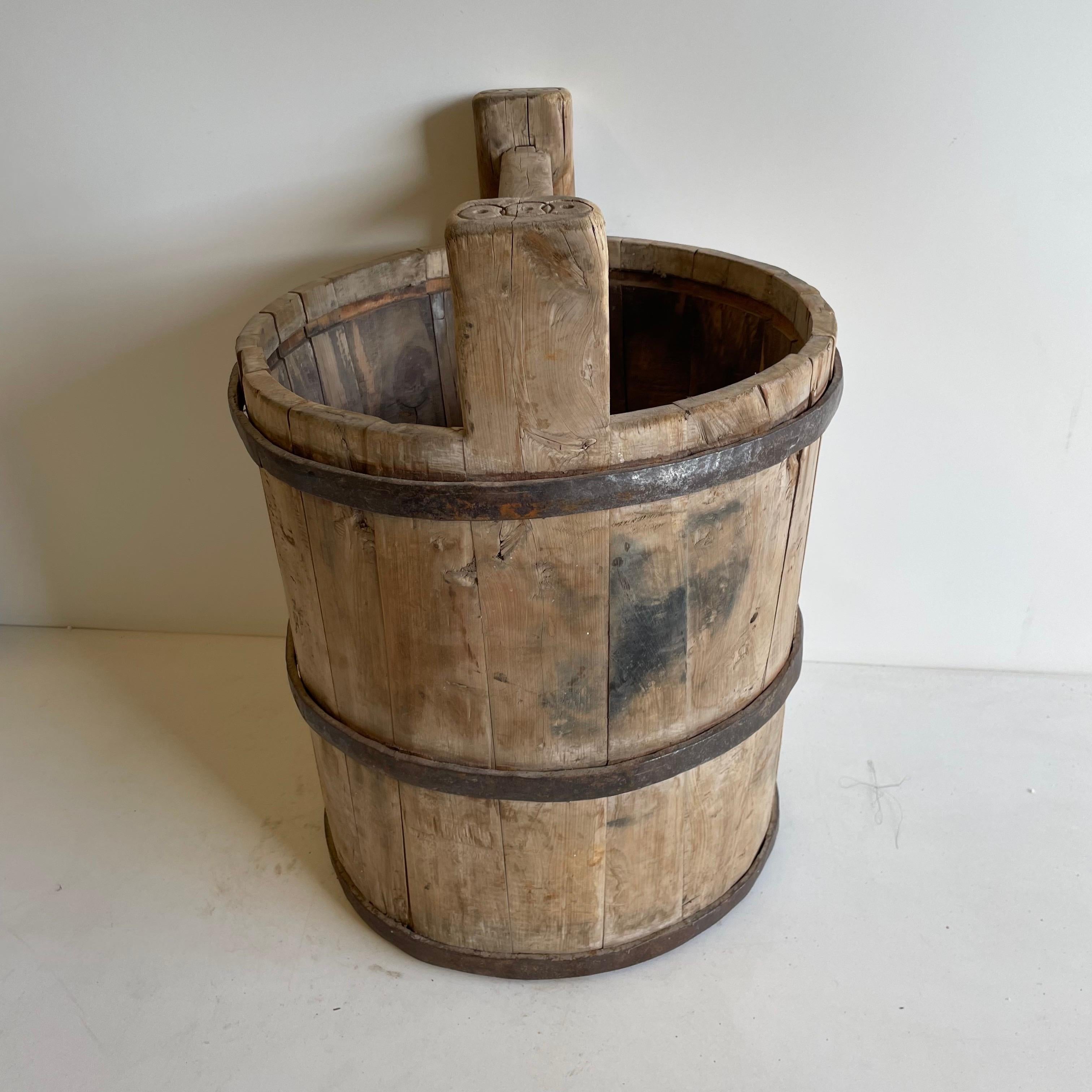 Antique Asian Cypress wood buckets used in the fields to collect vegetables, and food. Great now for in the home or garden. 
Measures: 14.5