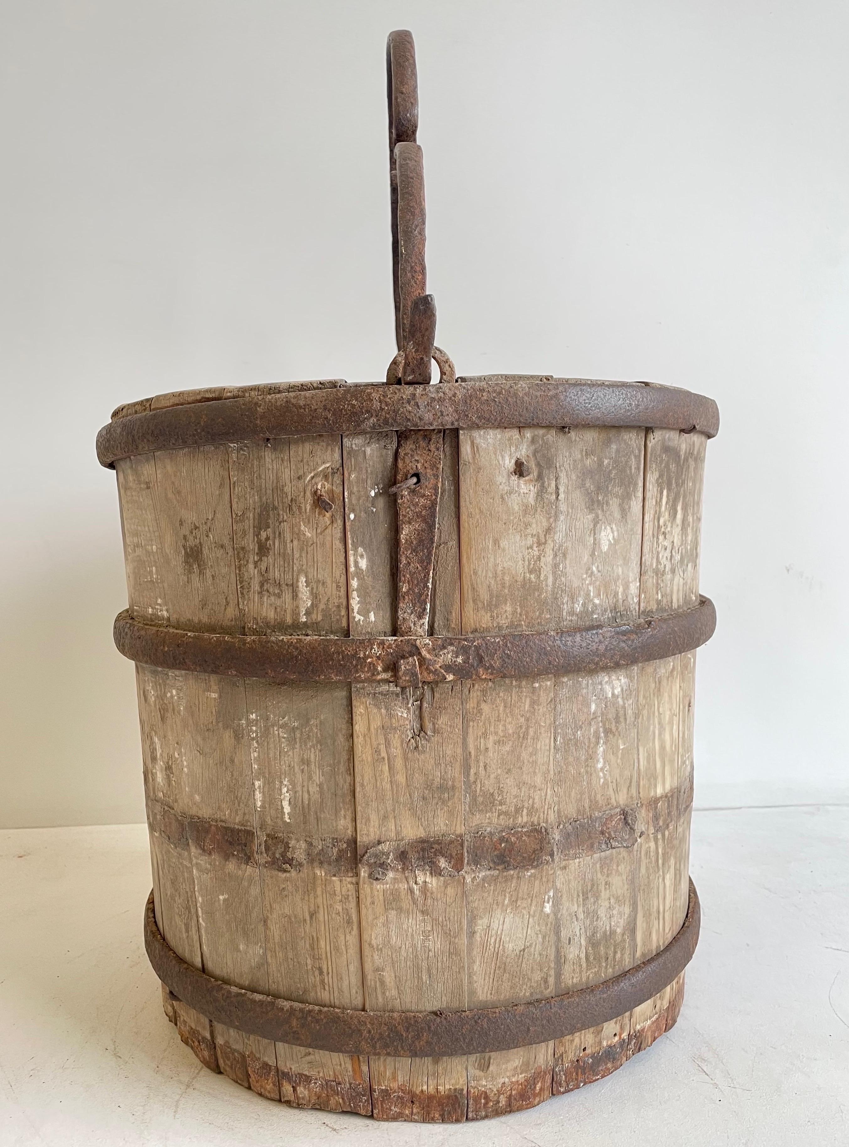 antique wooden bucket with lid